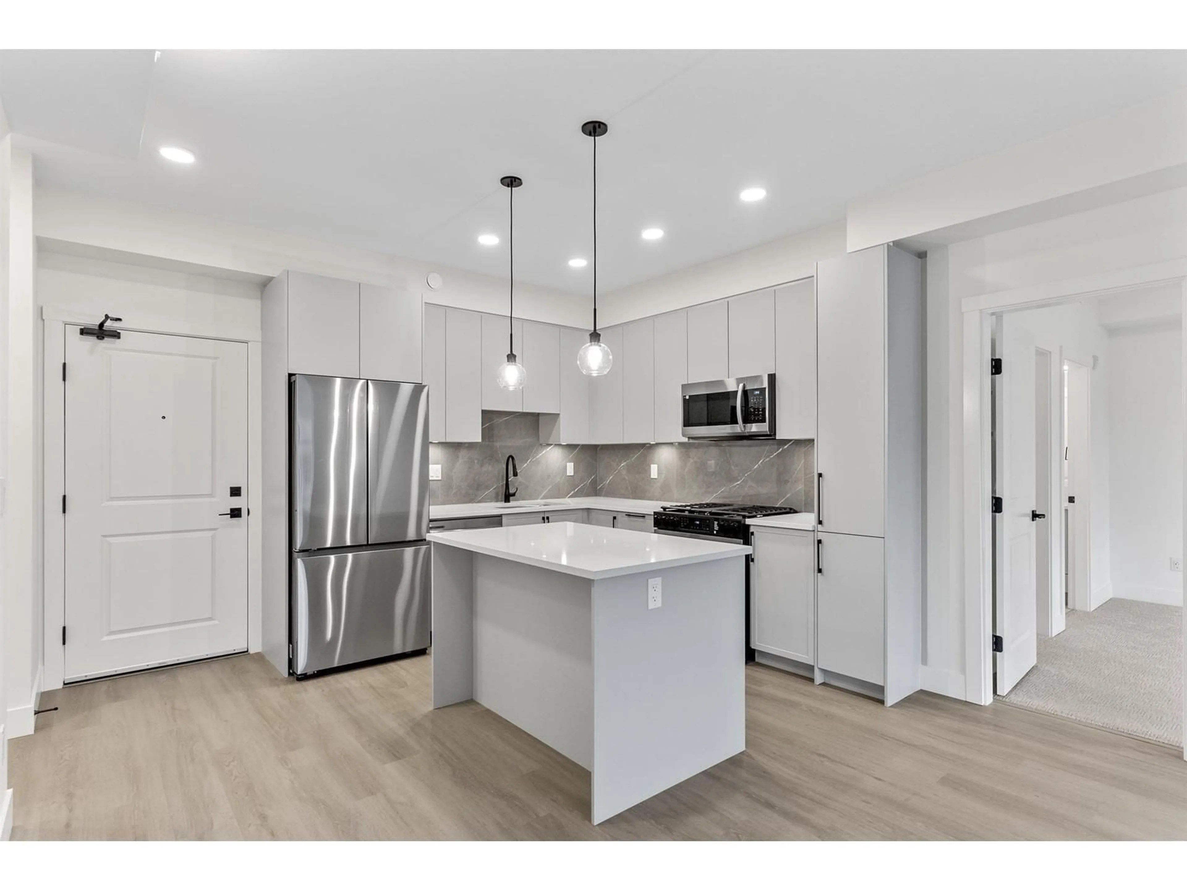 Open concept kitchen, unknown for 615 - 3528 146A STREET, Surrey British Columbia V4P0H4