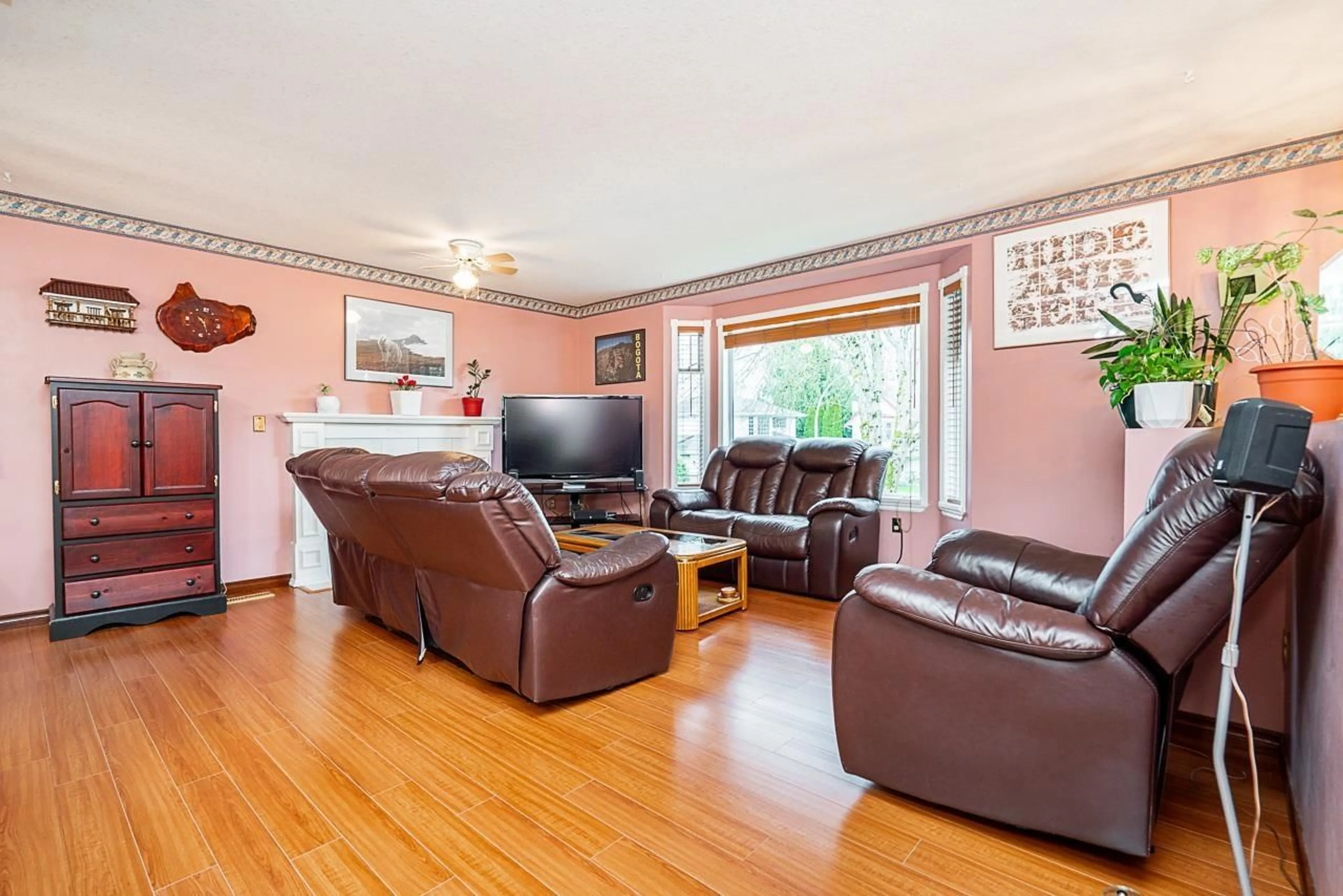 Living room with furniture, wood/laminate floor for 2697 273A STREET, Langley British Columbia V4W3K3