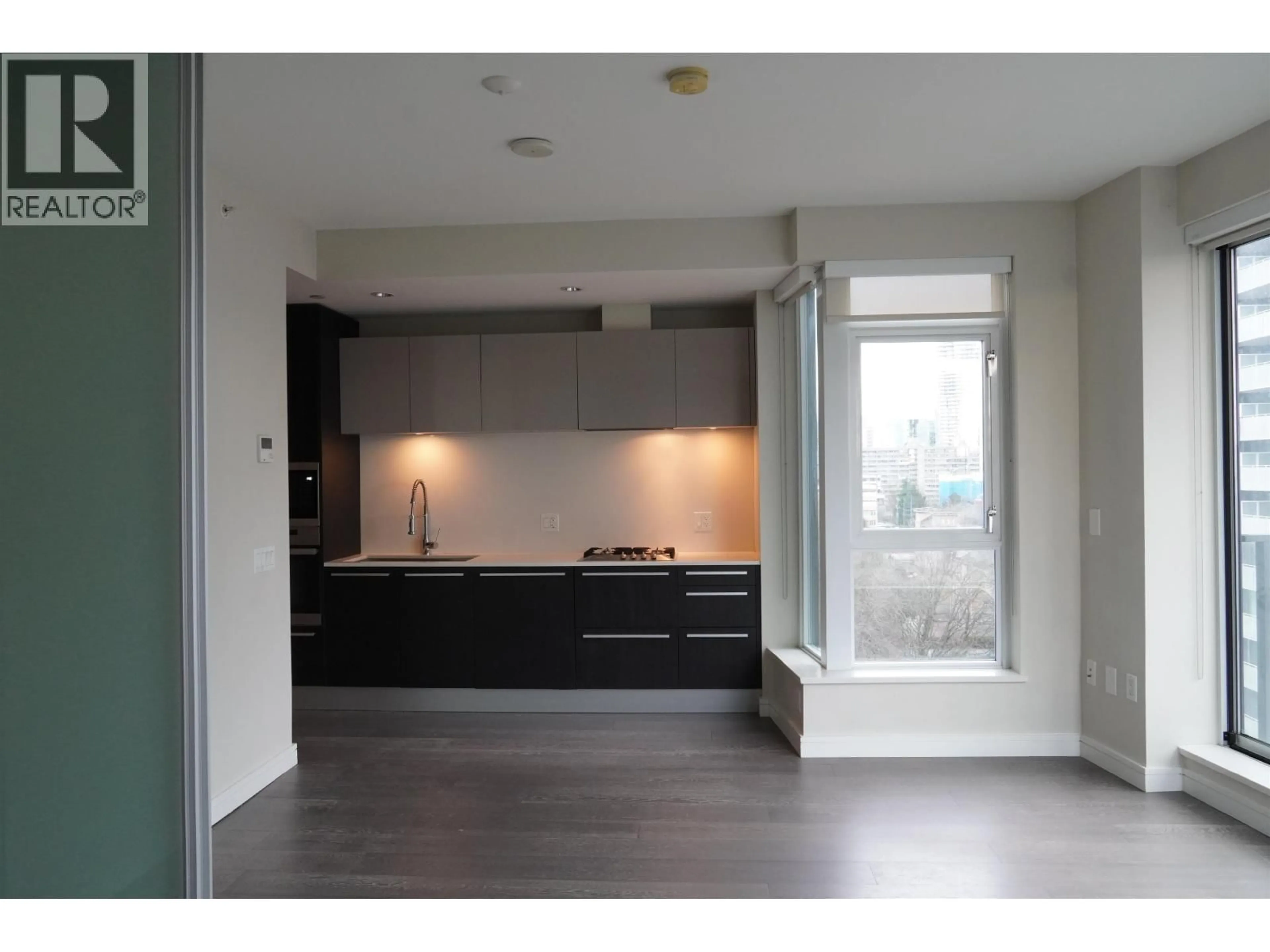 Open concept kitchen, wood/laminate floor for 1103 - 1221 BIDWELL STREET, Vancouver British Columbia V6G0B1