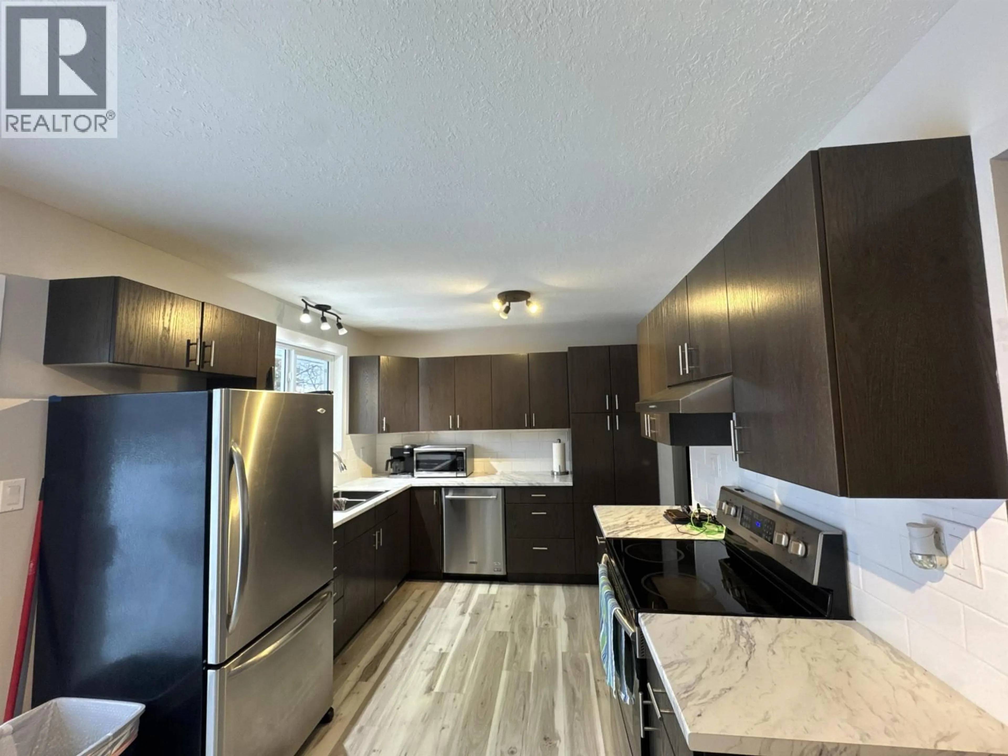 Open concept kitchen, unknown for 10411 105 AVENUE, Fort St. John British Columbia V1J2M7