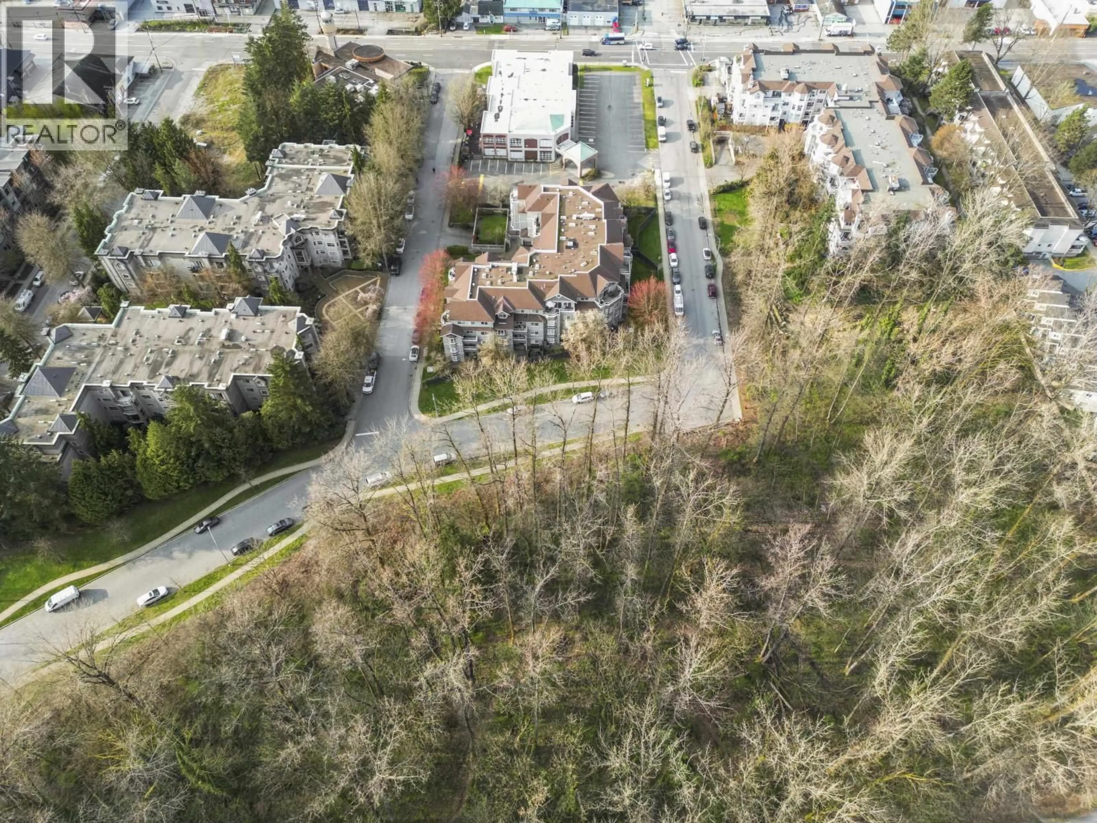 A pic from outside/outdoor area/front of a property/back of a property/a pic from drone, street for 309 - 2620 JANE STREET, Port Coquitlam British Columbia V3C6J3