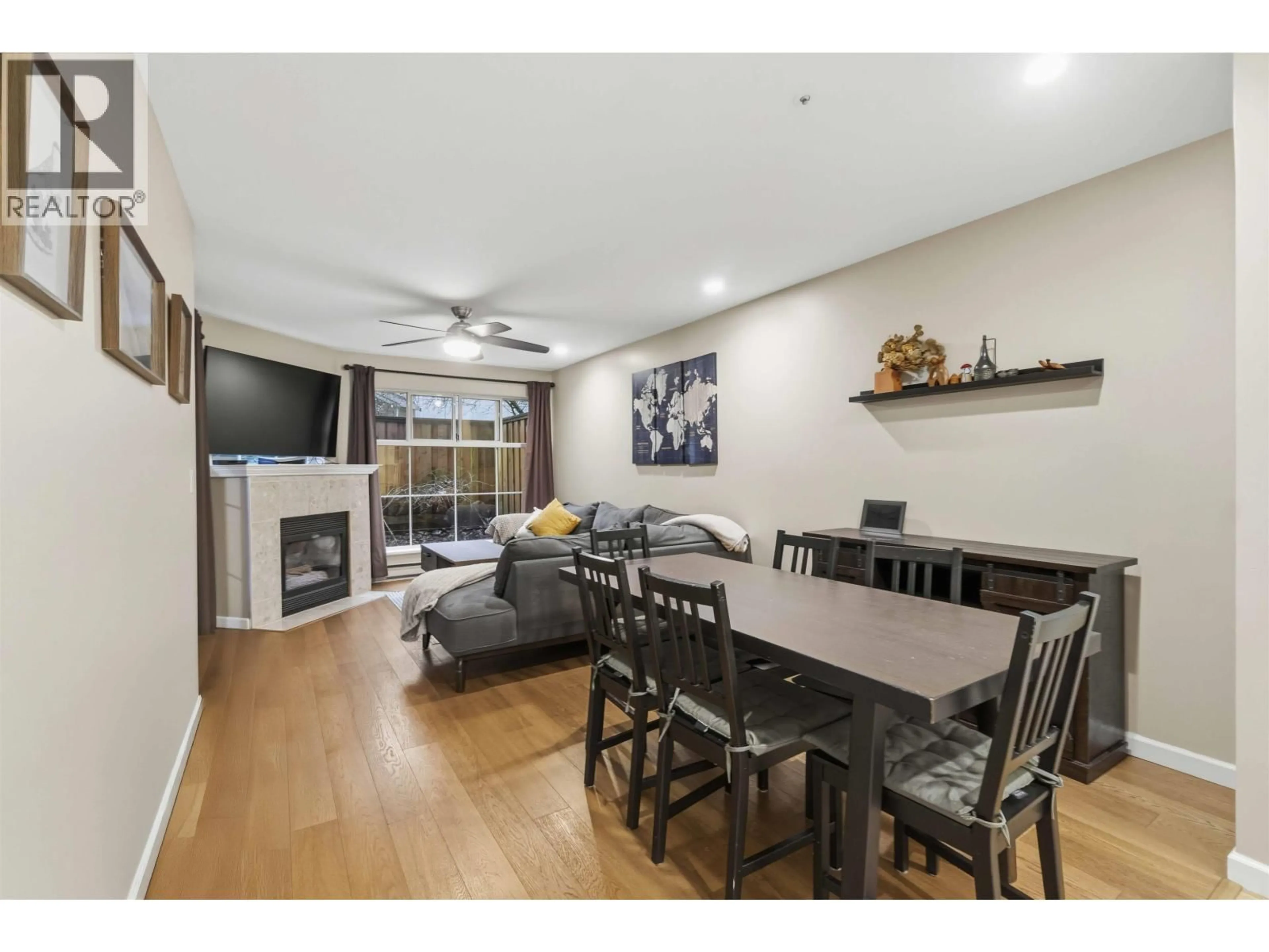 Living room with furniture, wood/laminate floor for 111 - 2678 DIXON STREET, Port Coquitlam British Columbia V3C6L7