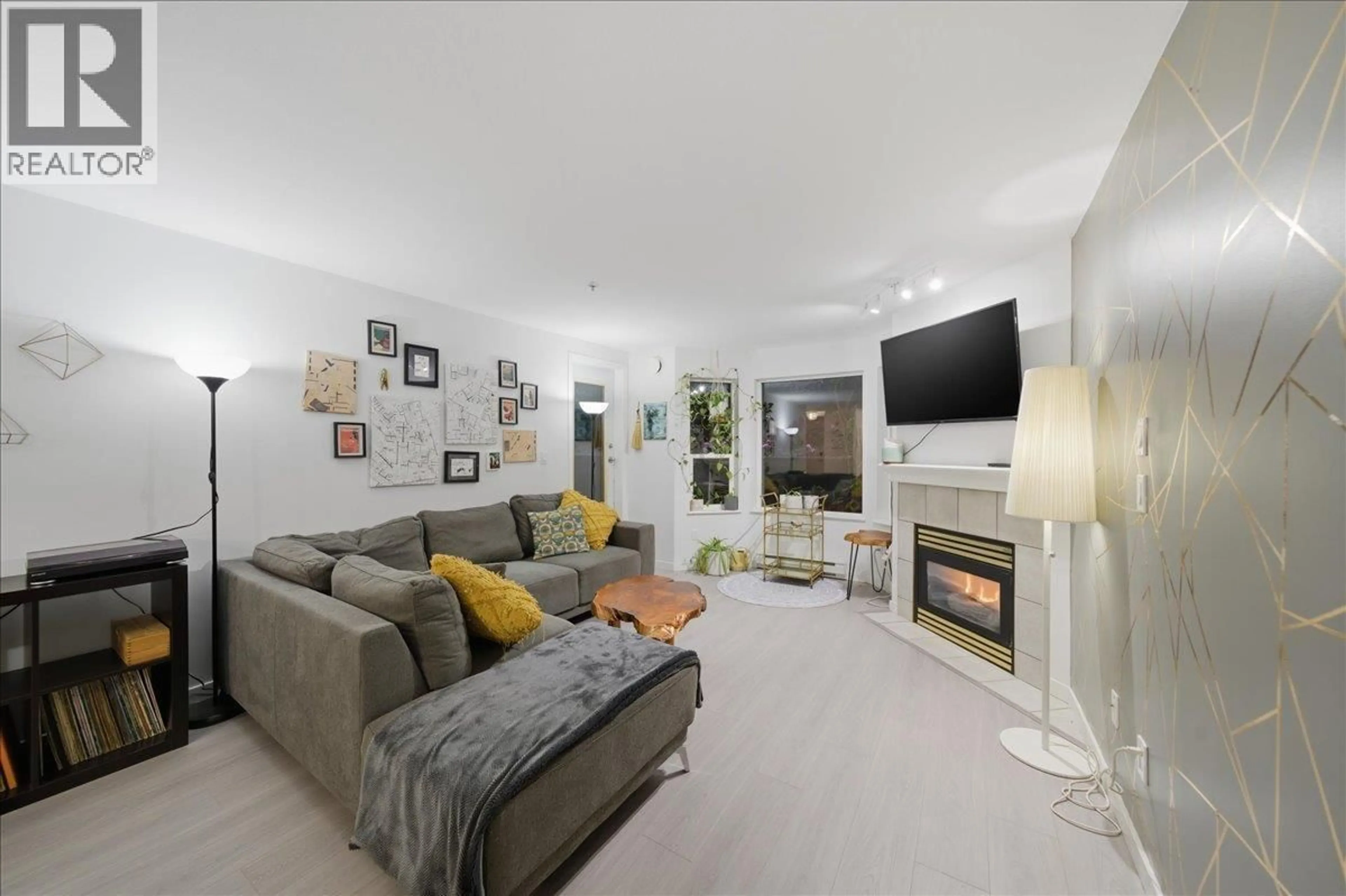 Living room with furniture, unknown for 311 - 121 SHORELINE CIRCLE, Port Moody British Columbia V3H5G2