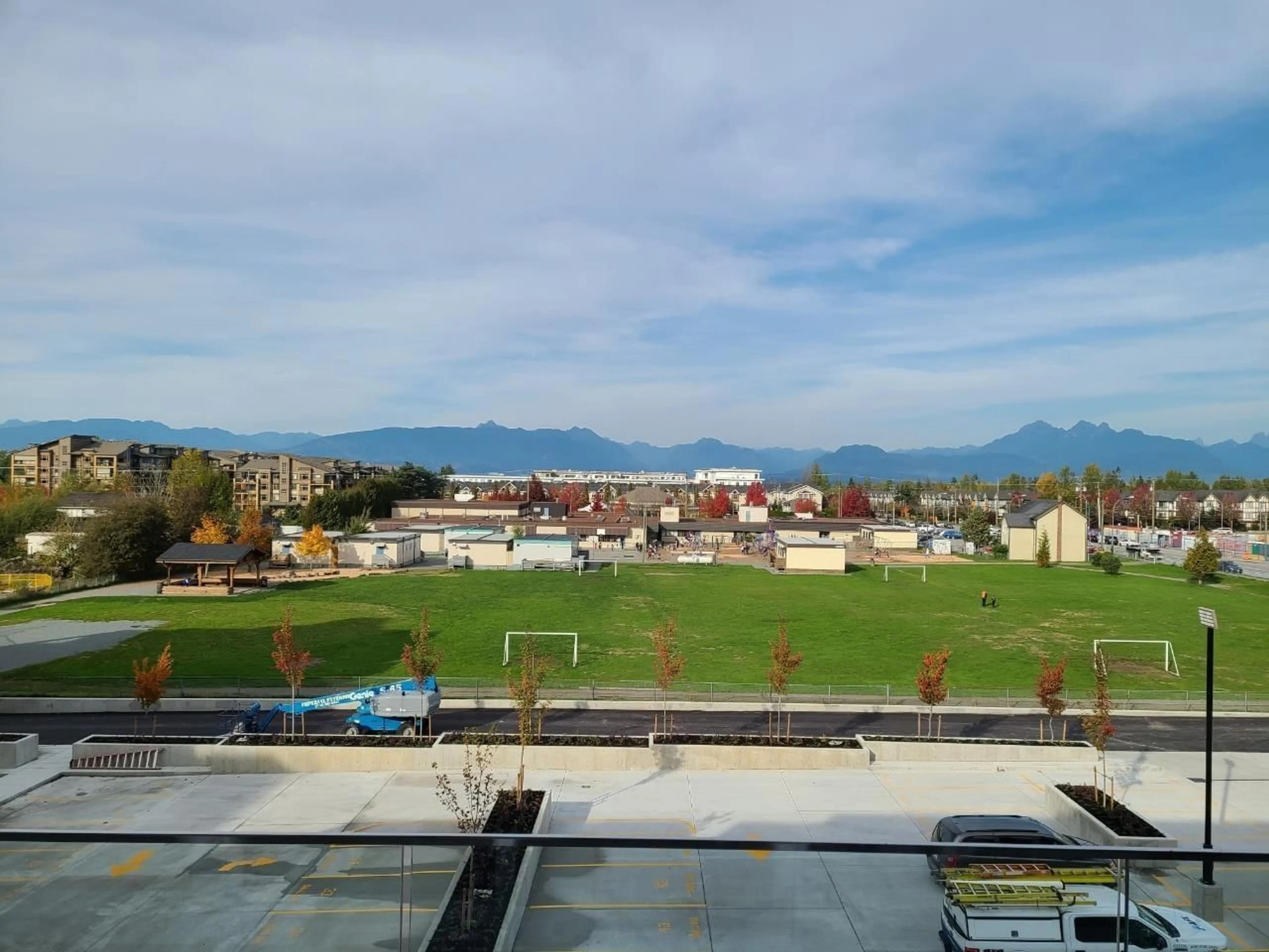 A pic from outside/outdoor area/front of a property/back of a property/a pic from drone, mountain view for A327 - 20727 WILLOUGHBY TOWN CENTRE DRIVE, Langley British Columbia V2Y3N1