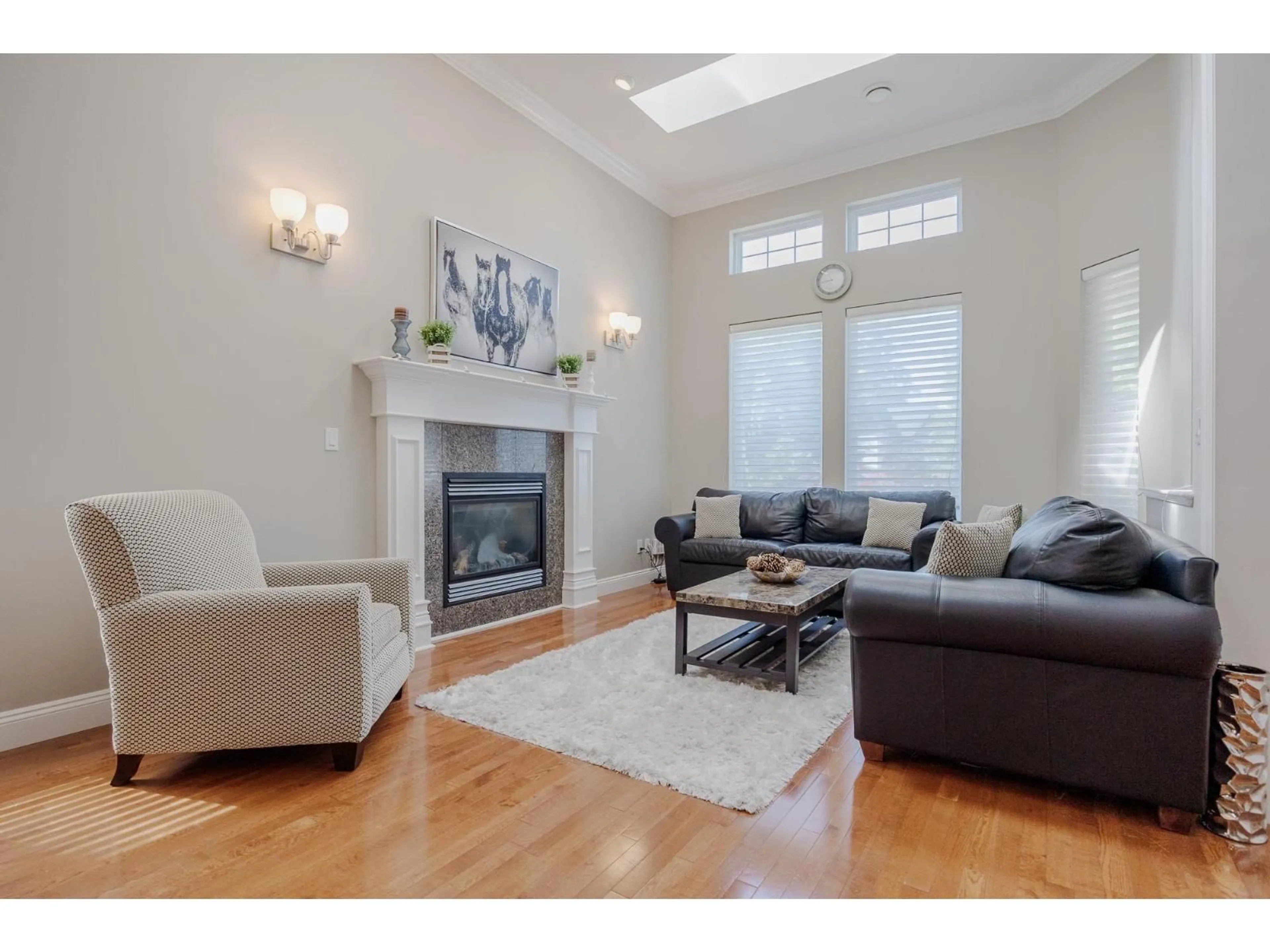 Living room with furniture, wood/laminate floor for 6648 181 STREET, Surrey British Columbia V3S9A2