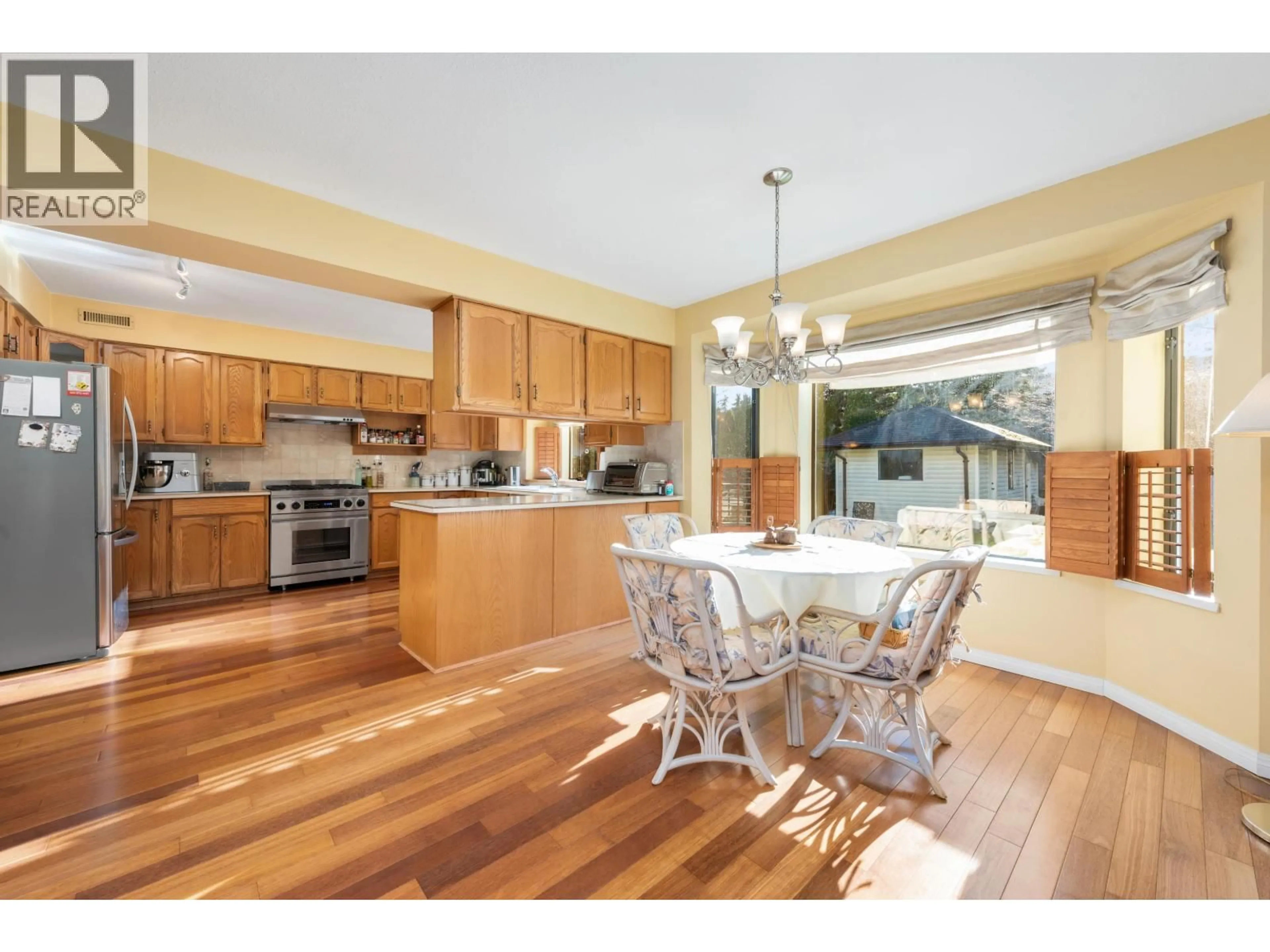 Open concept kitchen, wood/laminate floor for 4366 STEVESTON HIGHWAY, Richmond British Columbia V7E2K3