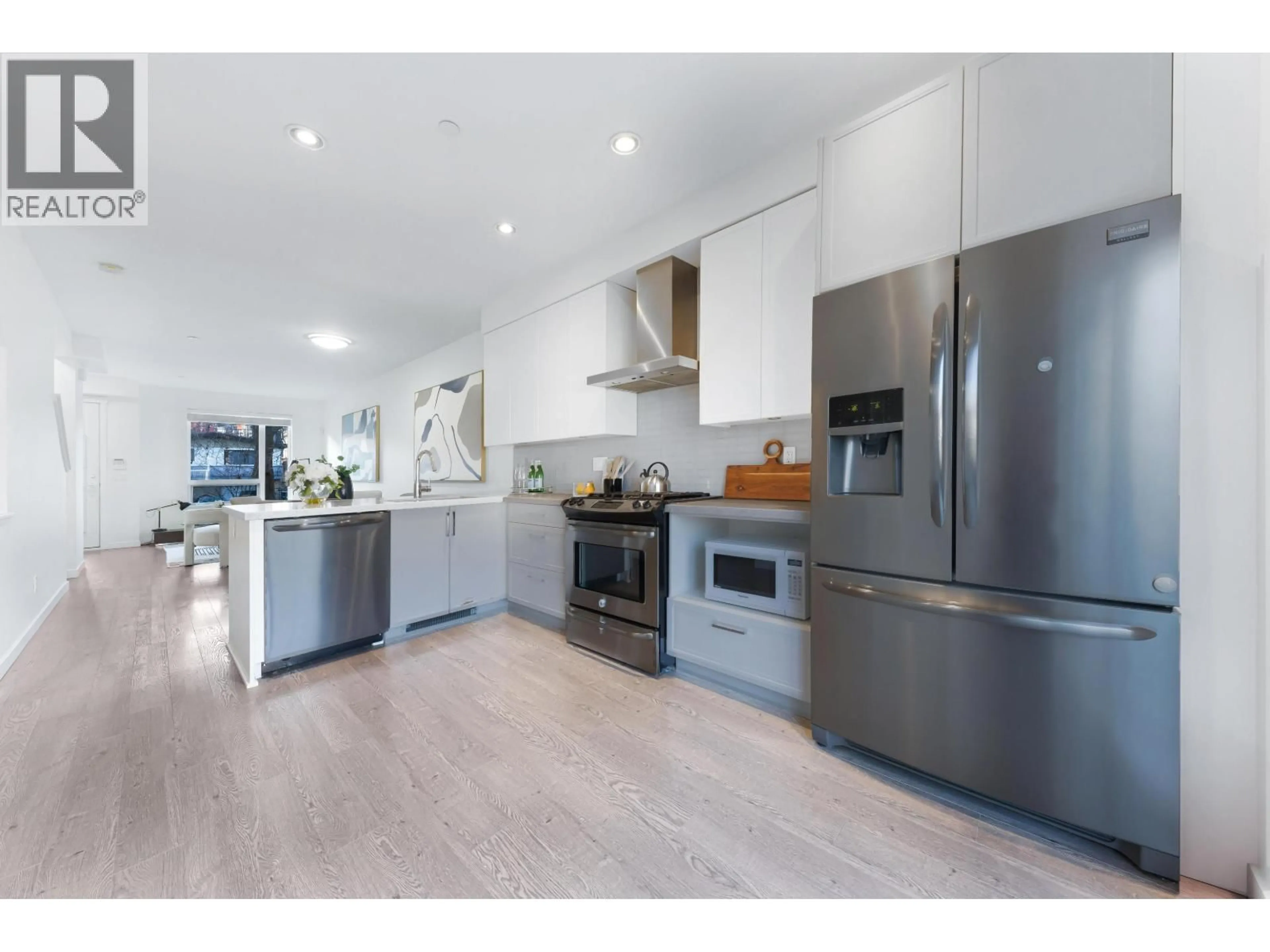 Open concept kitchen, wood/laminate floor for 2763 DUKE STREET, Vancouver British Columbia V5R4S8