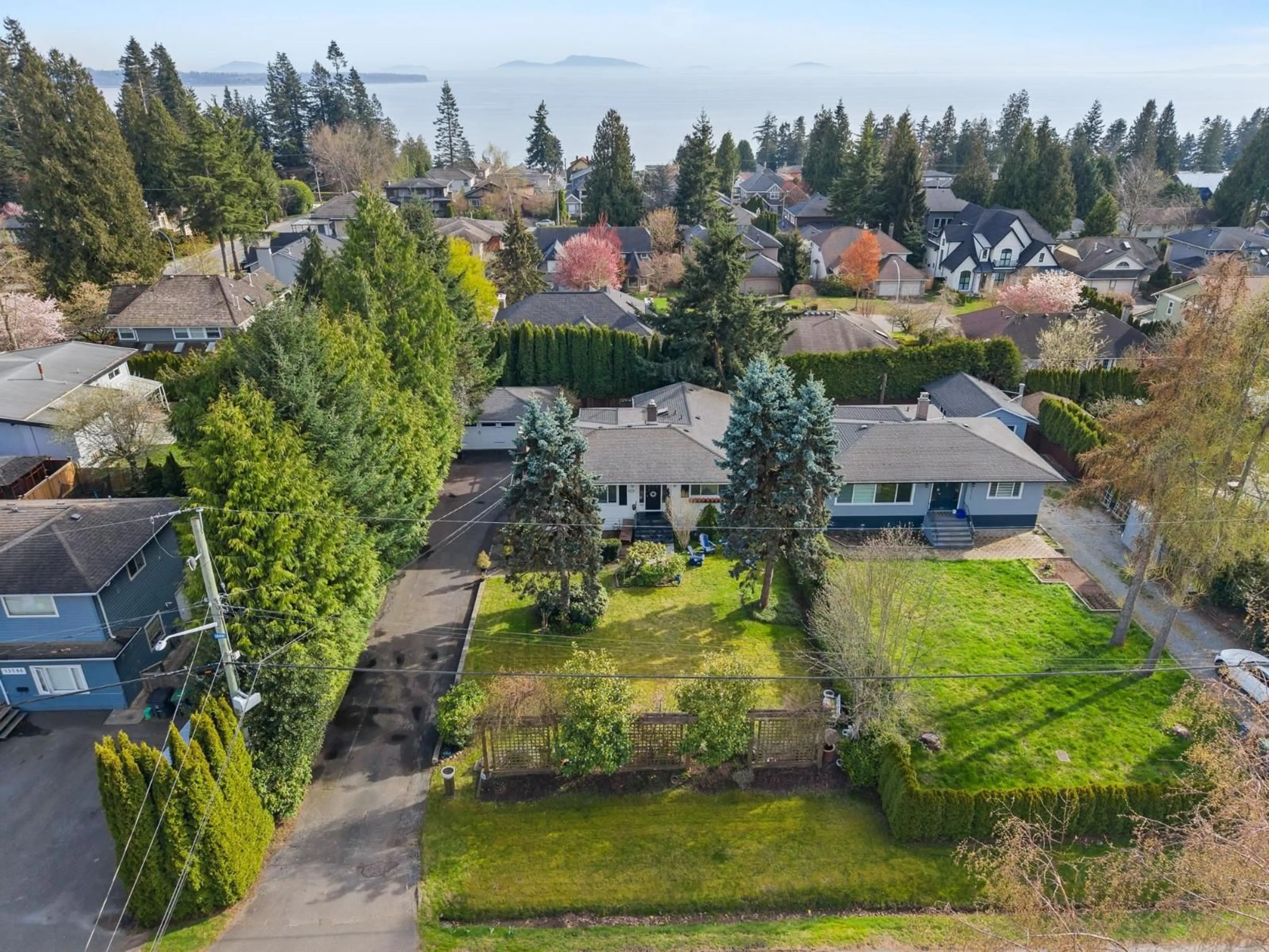 A pic from outside/outdoor area/front of a property/back of a property/a pic from drone, unknown for 13558 15 AVENUE, Surrey British Columbia V4A1L2