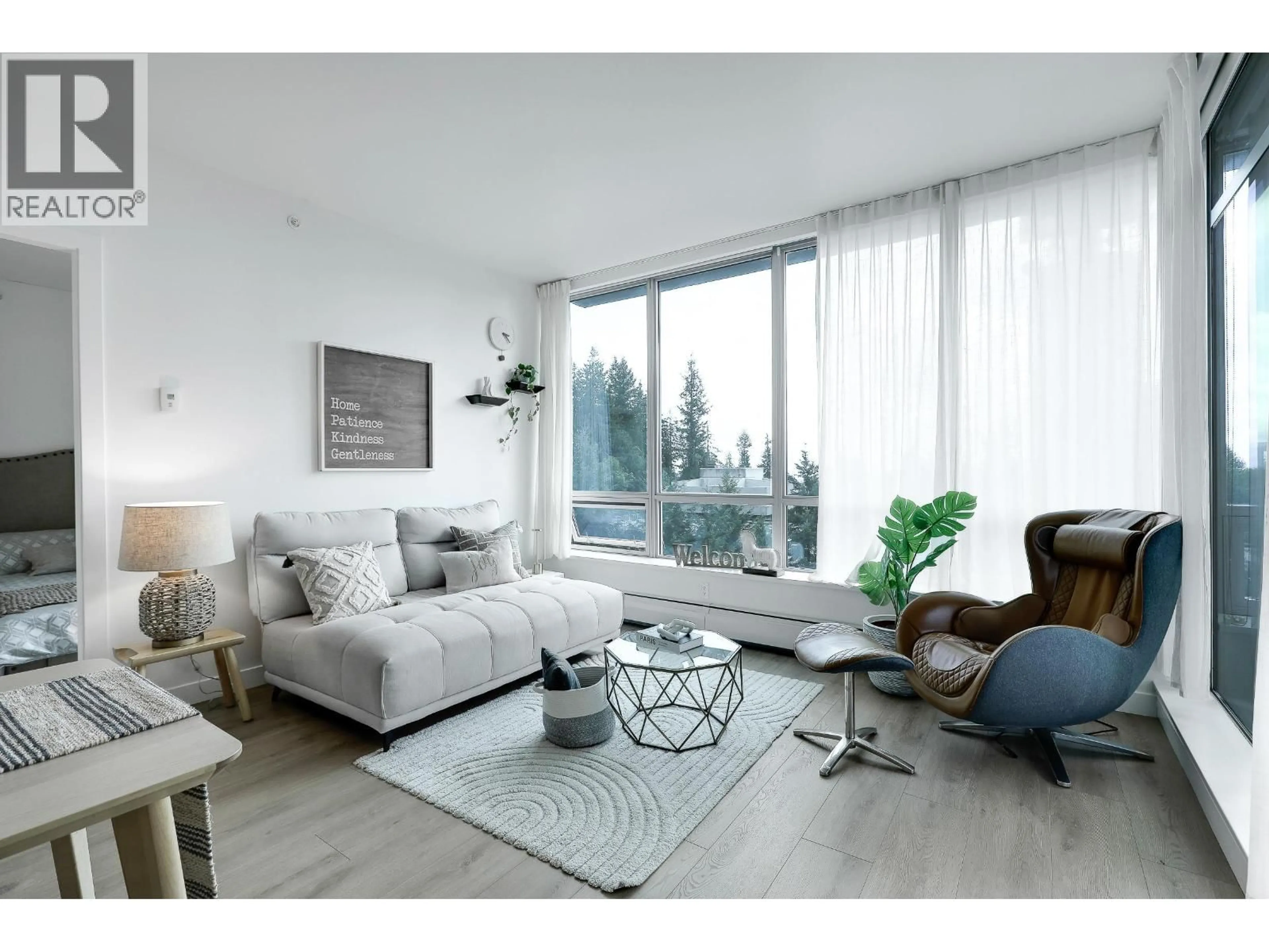 Living room with furniture, wood/laminate floor for 803 - 9060 UNIVERSITY CRESCENT, Burnaby British Columbia V5A0E1