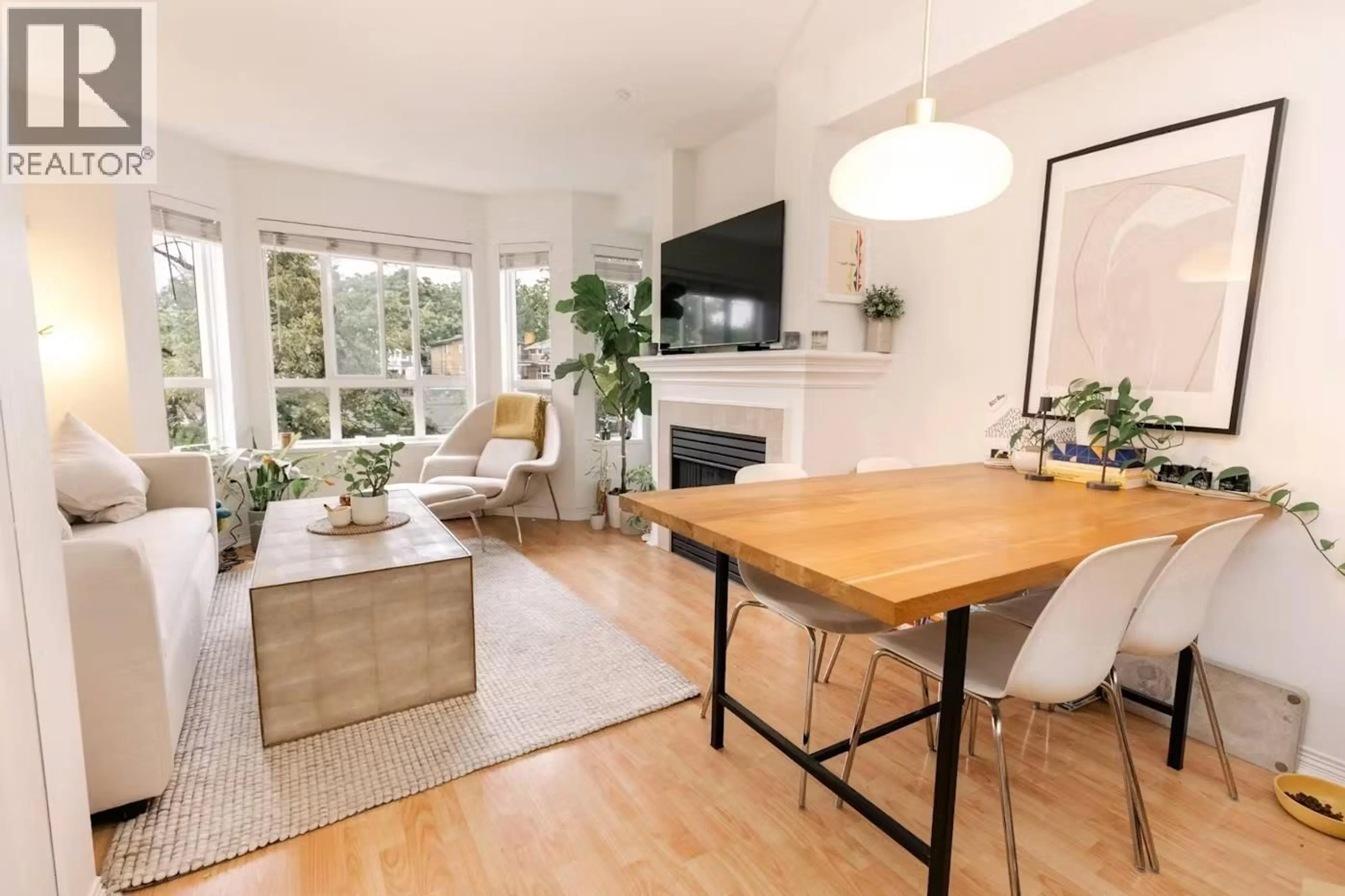 Living room with furniture, wood/laminate floor for 307 - 2545 BROADWAY, Vancouver British Columbia V6K2E9