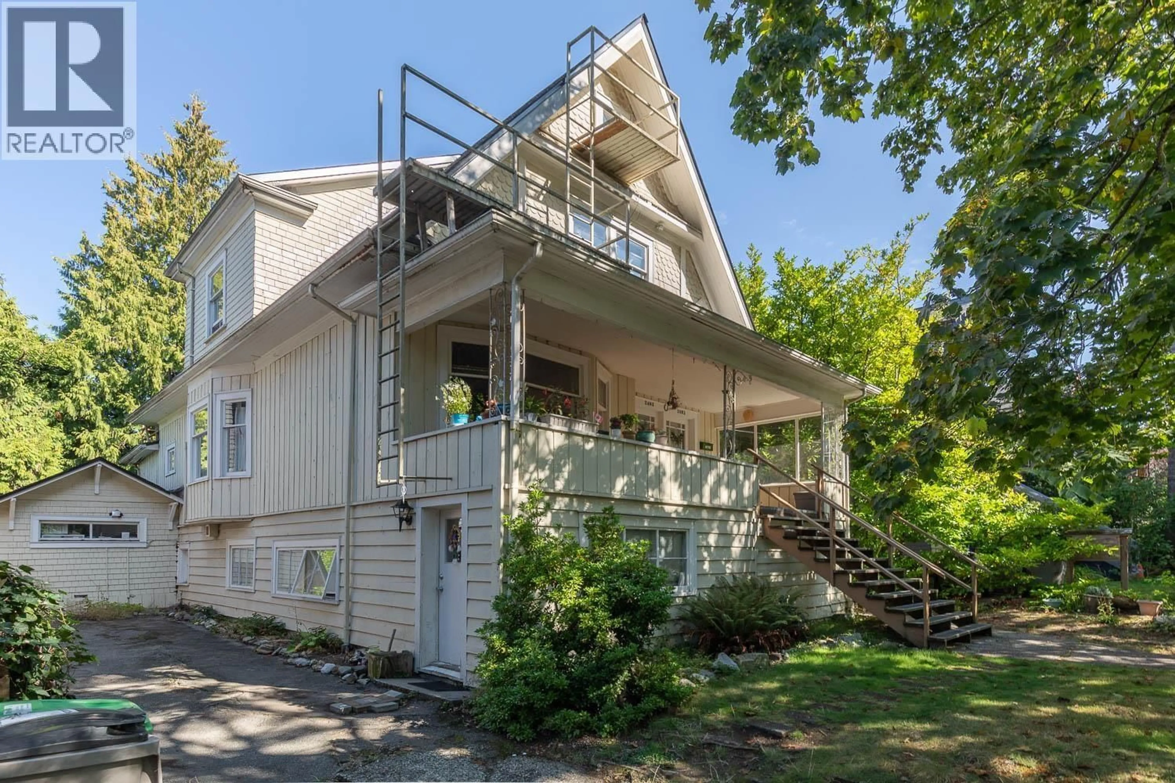 Home with vinyl exterior material, street for 2483 6TH AVENUE, Vancouver British Columbia V6K1W2