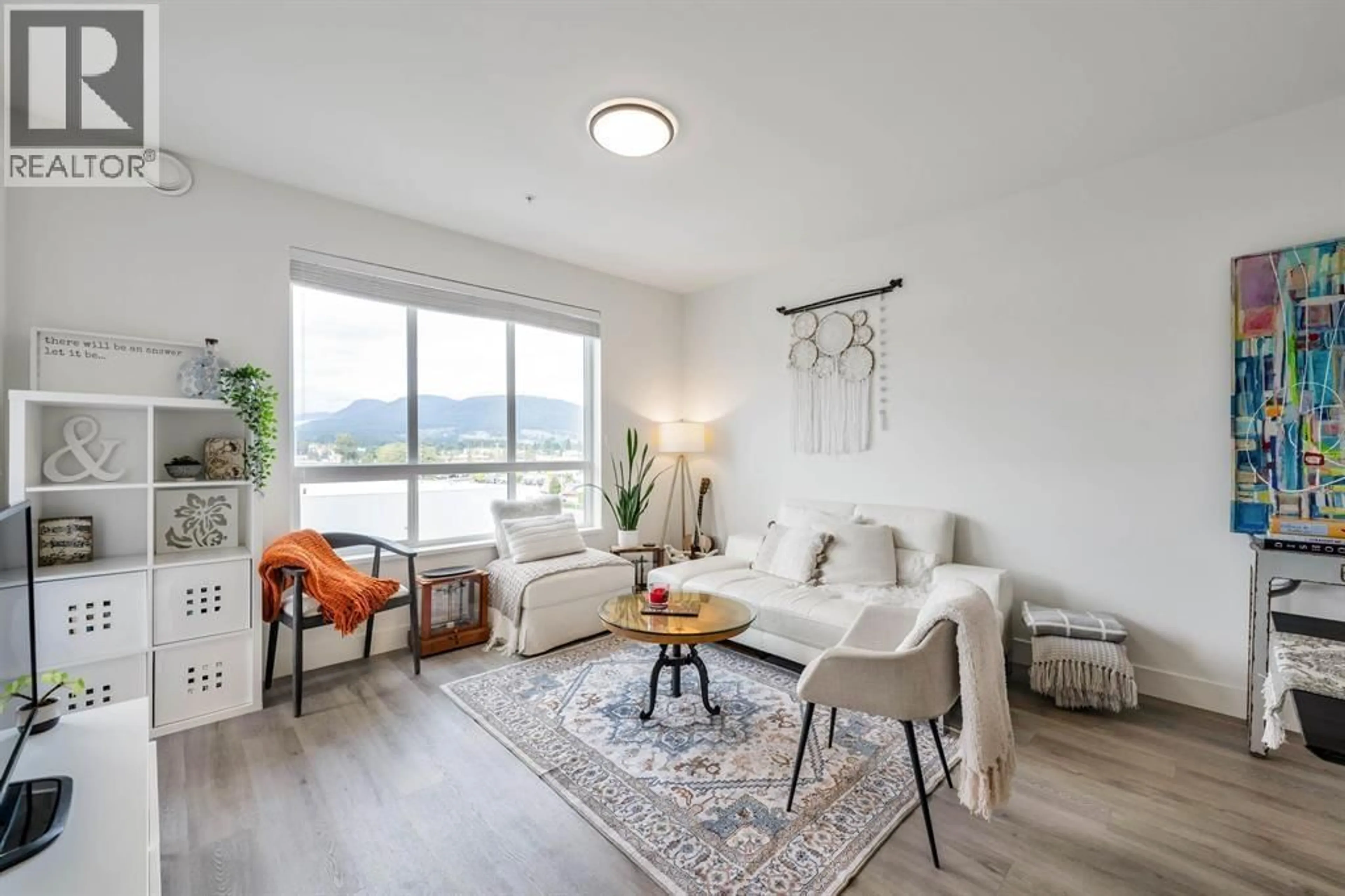 Living room with furniture, wood/laminate floor for 2506 - 2180 KELLY AVENUE, Port Coquitlam British Columbia V3C0S5