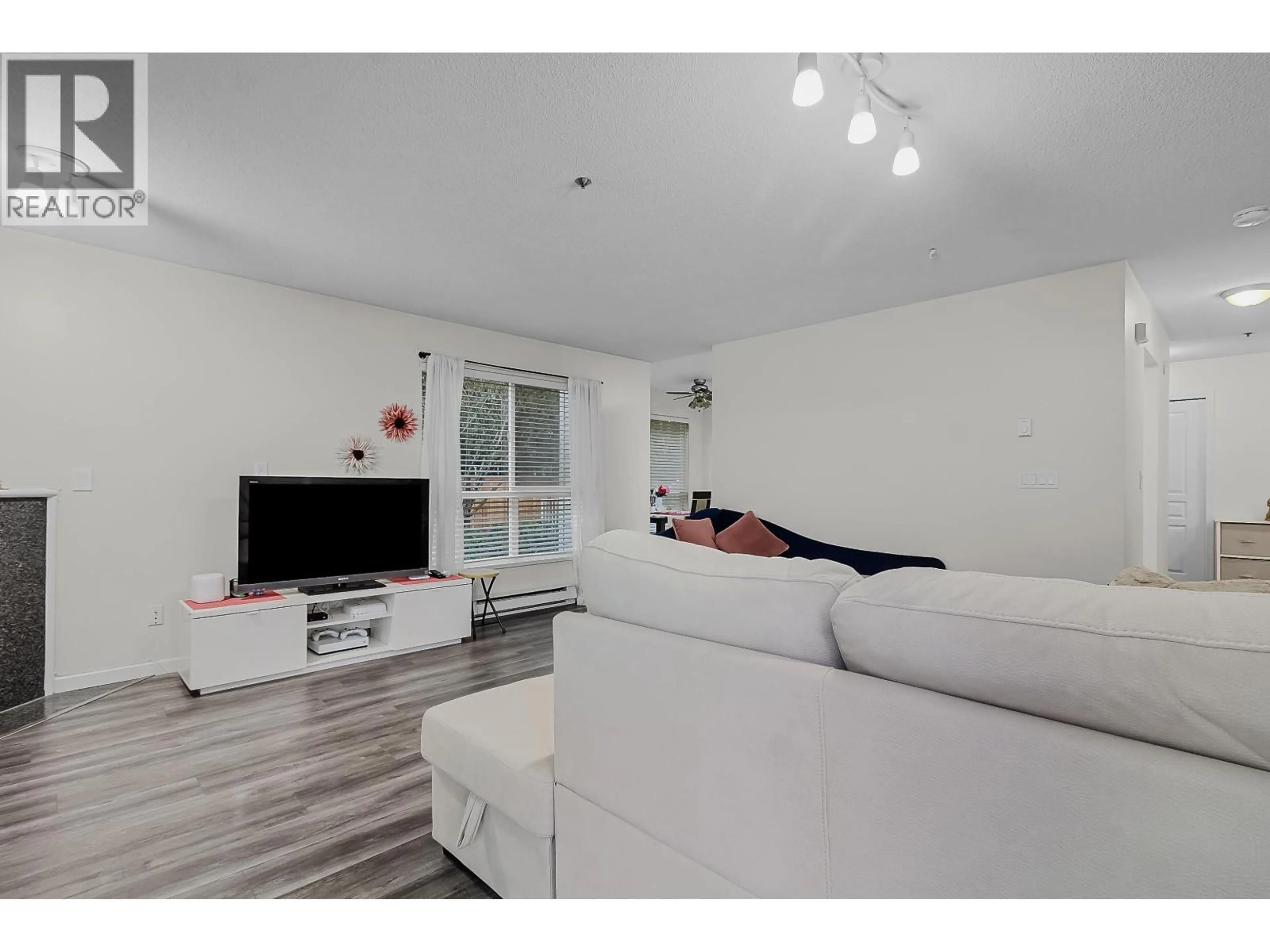 Living room with furniture, wood/laminate floor for 64 - 2727 KENT AVENUE NORTH, Vancouver British Columbia V5S3T9