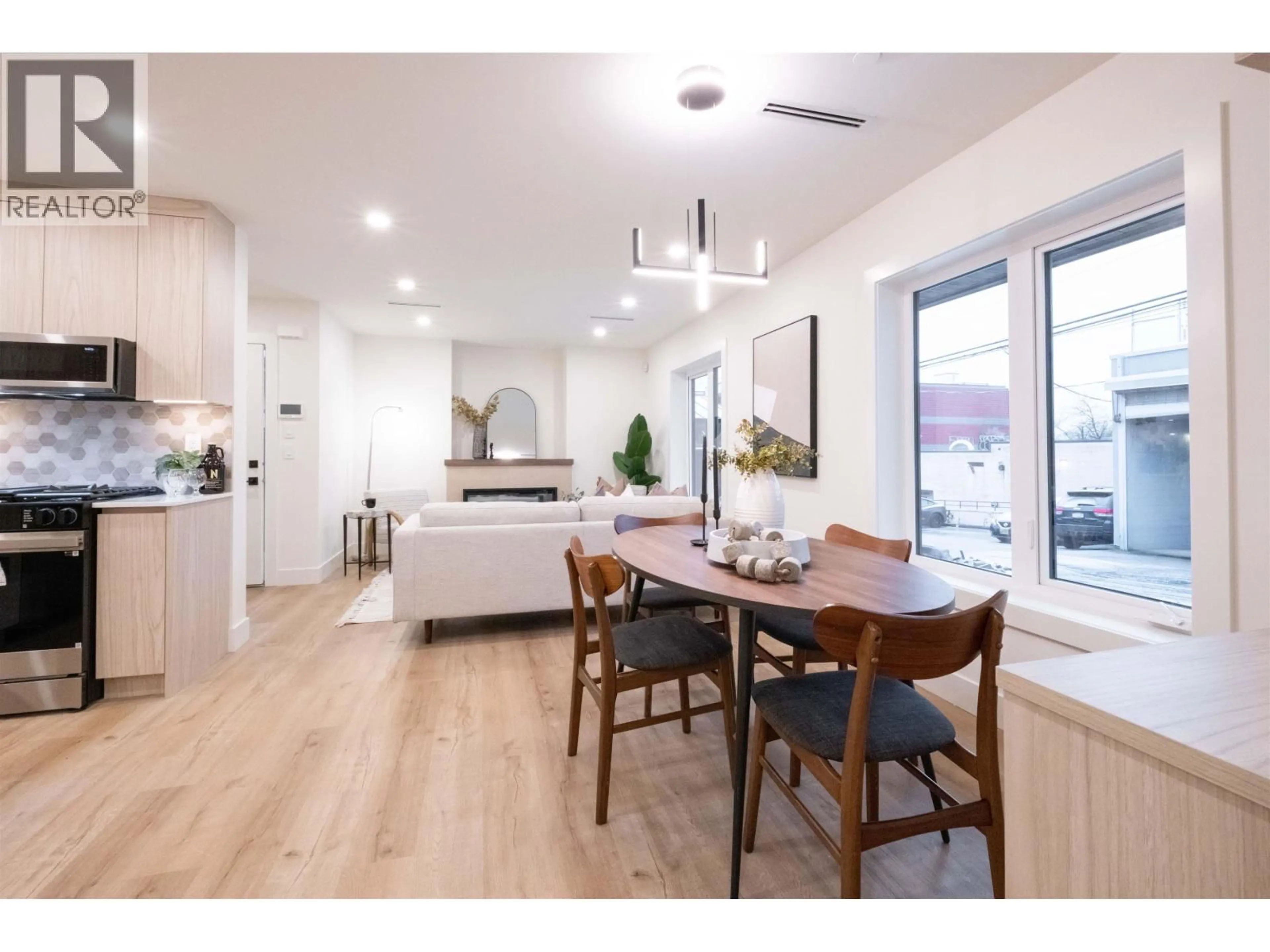 Open concept kitchen, wood/laminate floor for 2665 PENDER STREET, Vancouver British Columbia V5K2B6