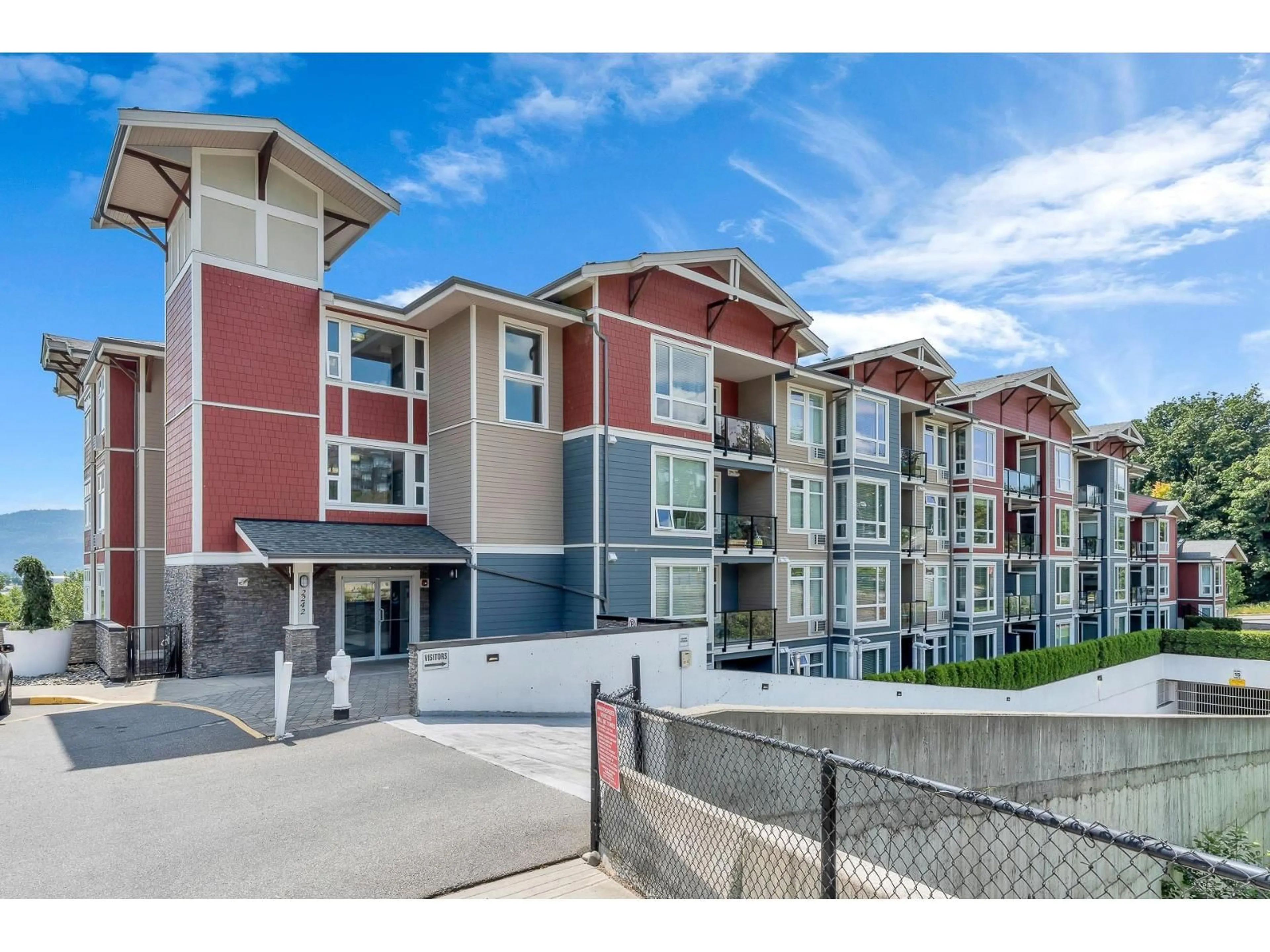 A pic from outside/outdoor area/front of a property/back of a property/a pic from drone, unknown for 406 - 2242 WHATCOM ROAD, Abbotsford British Columbia V3G0G3