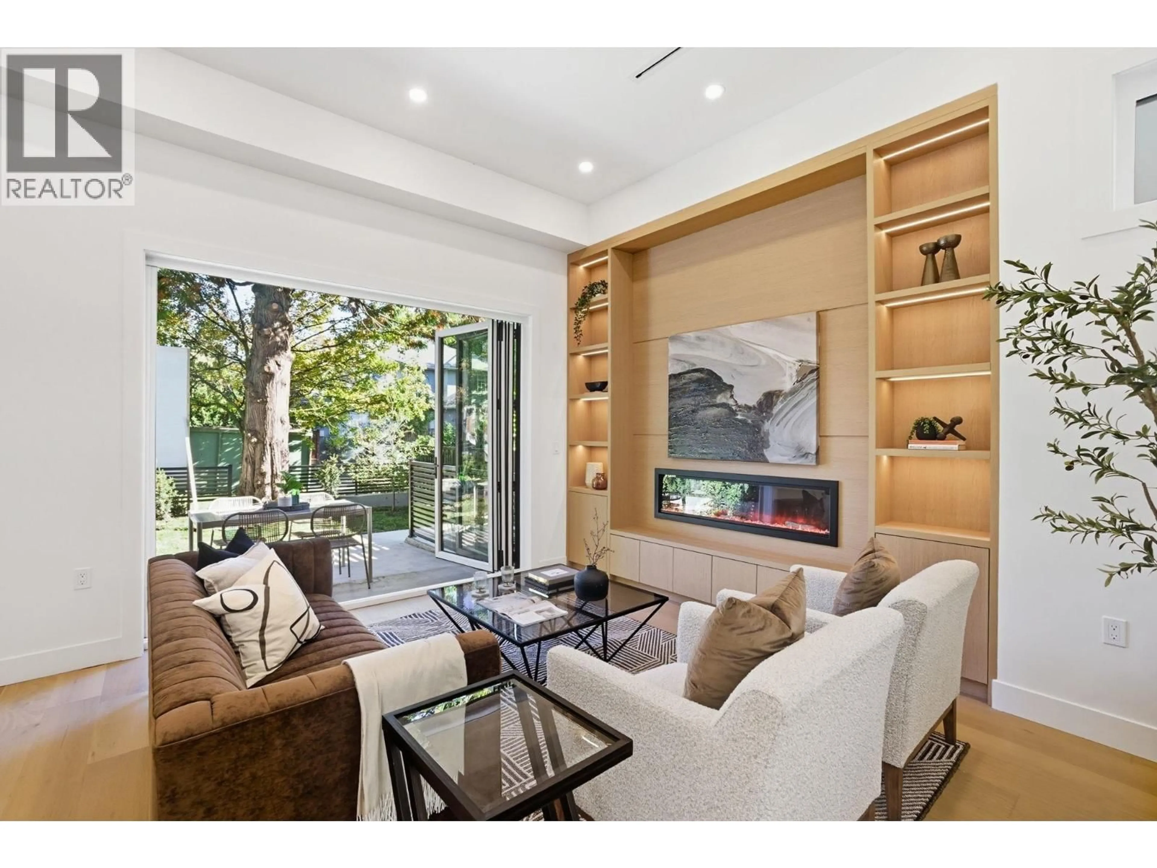 Living room with furniture, wood/laminate floor for 1 - 6141 YEW STREET, Vancouver British Columbia V6M3Z1