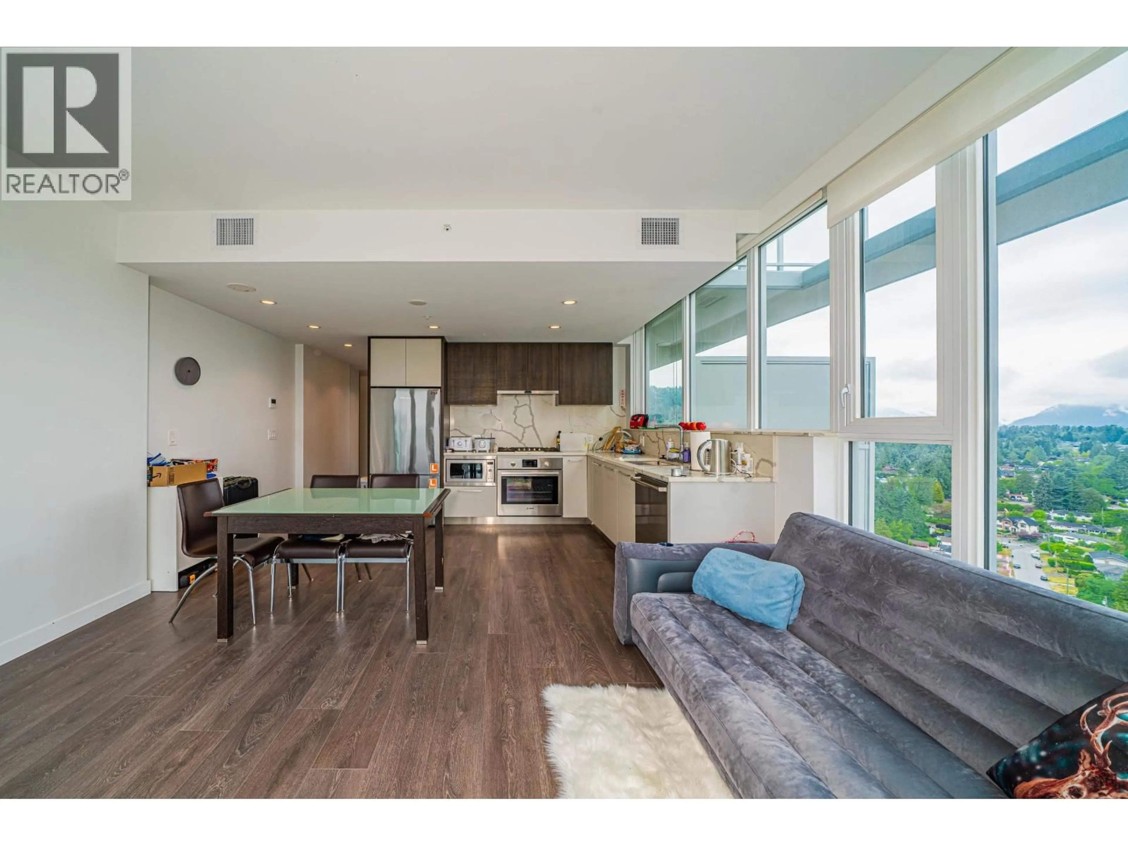 Open concept kitchen, wood/laminate floor for 1806 - 567 CLARKE ROAD, Coquitlam British Columbia V3J0K7