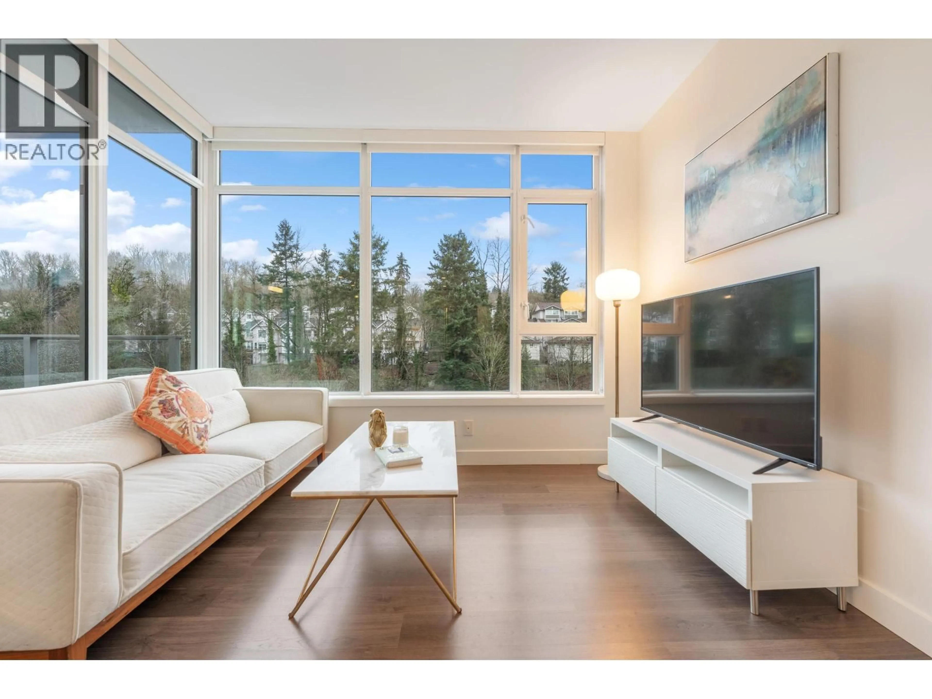 Living room with furniture, wood/laminate floor for 808 - 3557 SAWMILL CRESCENT, Vancouver British Columbia V5S0E2