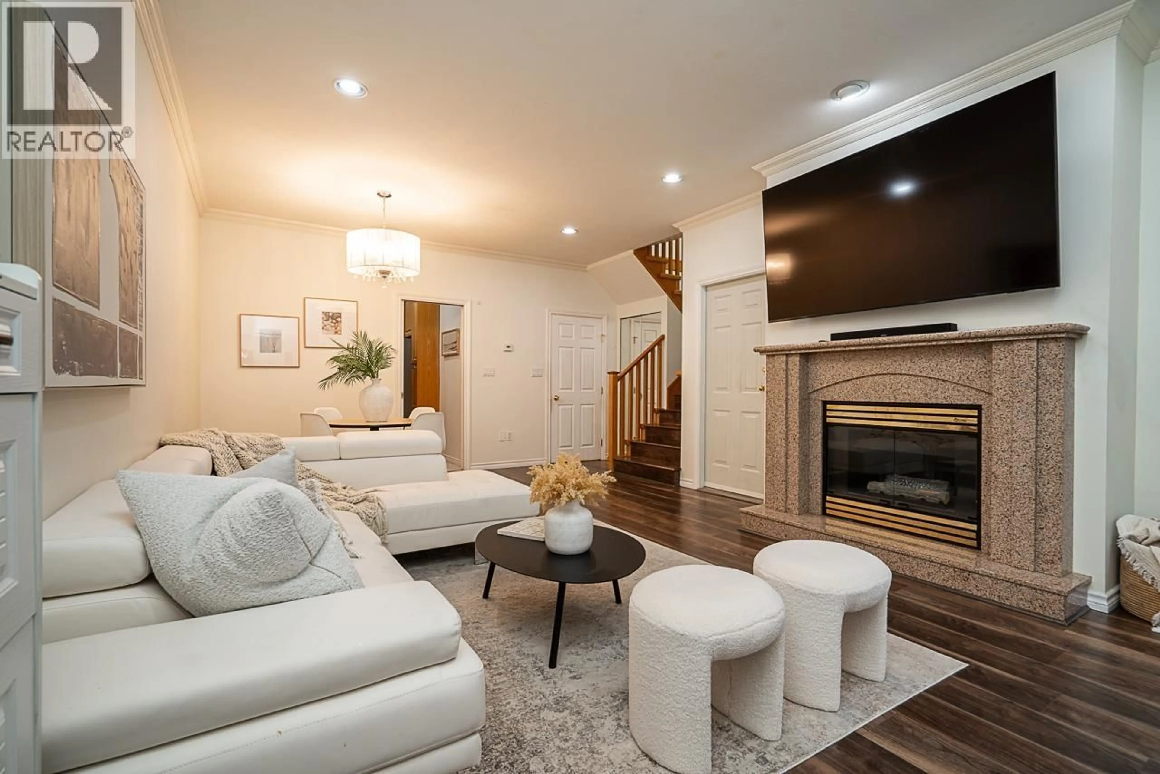 Living room with furniture, wood/laminate floor for 7408 18TH AVENUE, Burnaby British Columbia V3N1H5