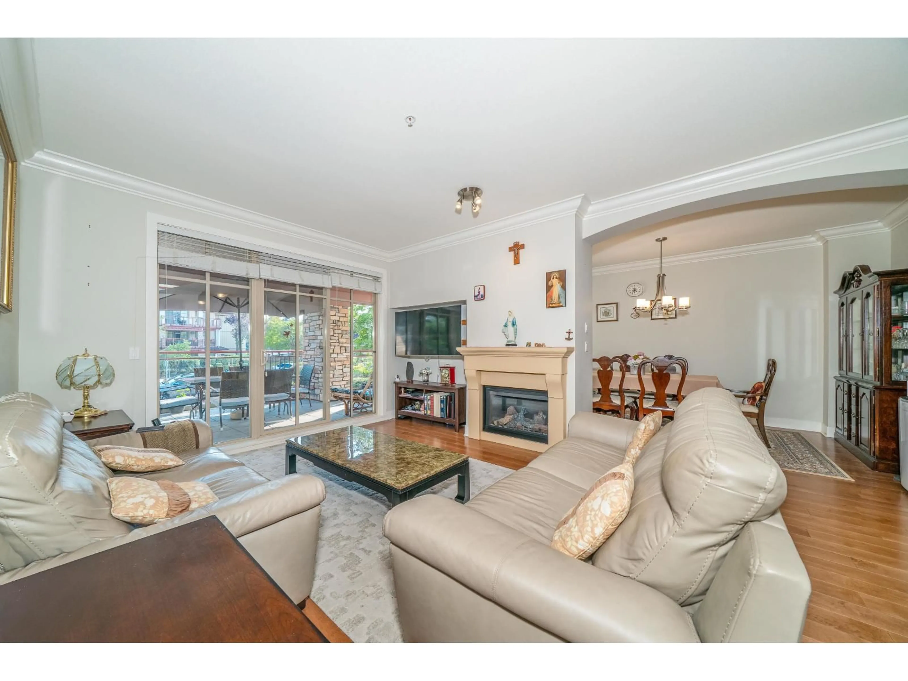 Living room with furniture, wood/laminate floor for 201 - 16477 64 AVENUE, Surrey British Columbia V3S6V7