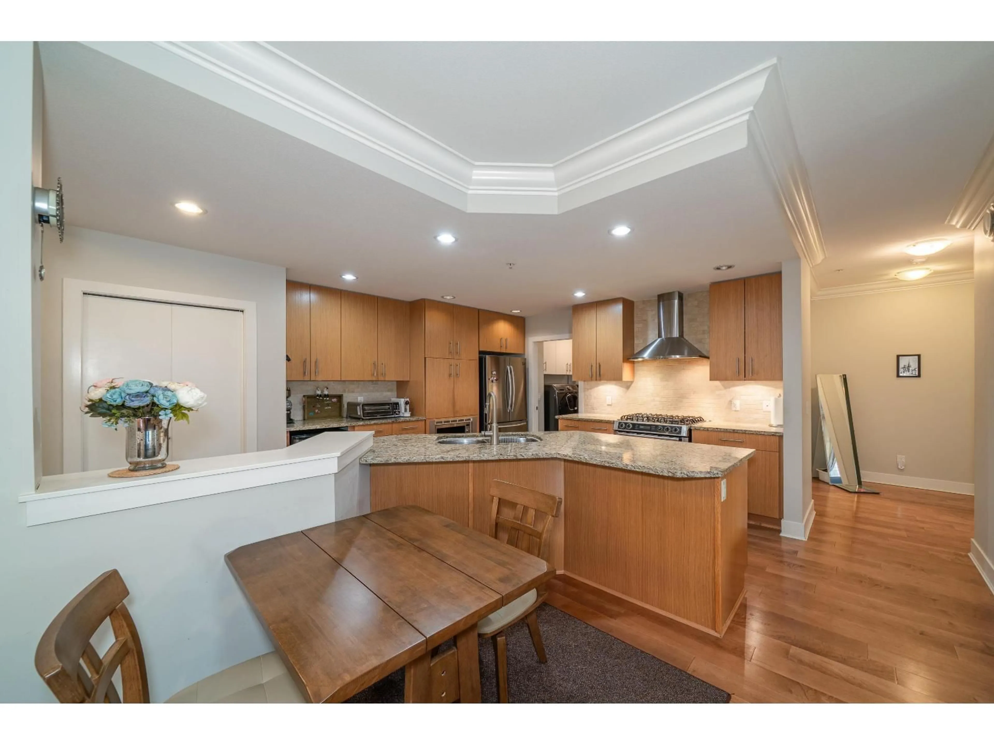 Open concept kitchen, wood/laminate floor for 201 - 16477 64 AVENUE, Surrey British Columbia V3S6V7