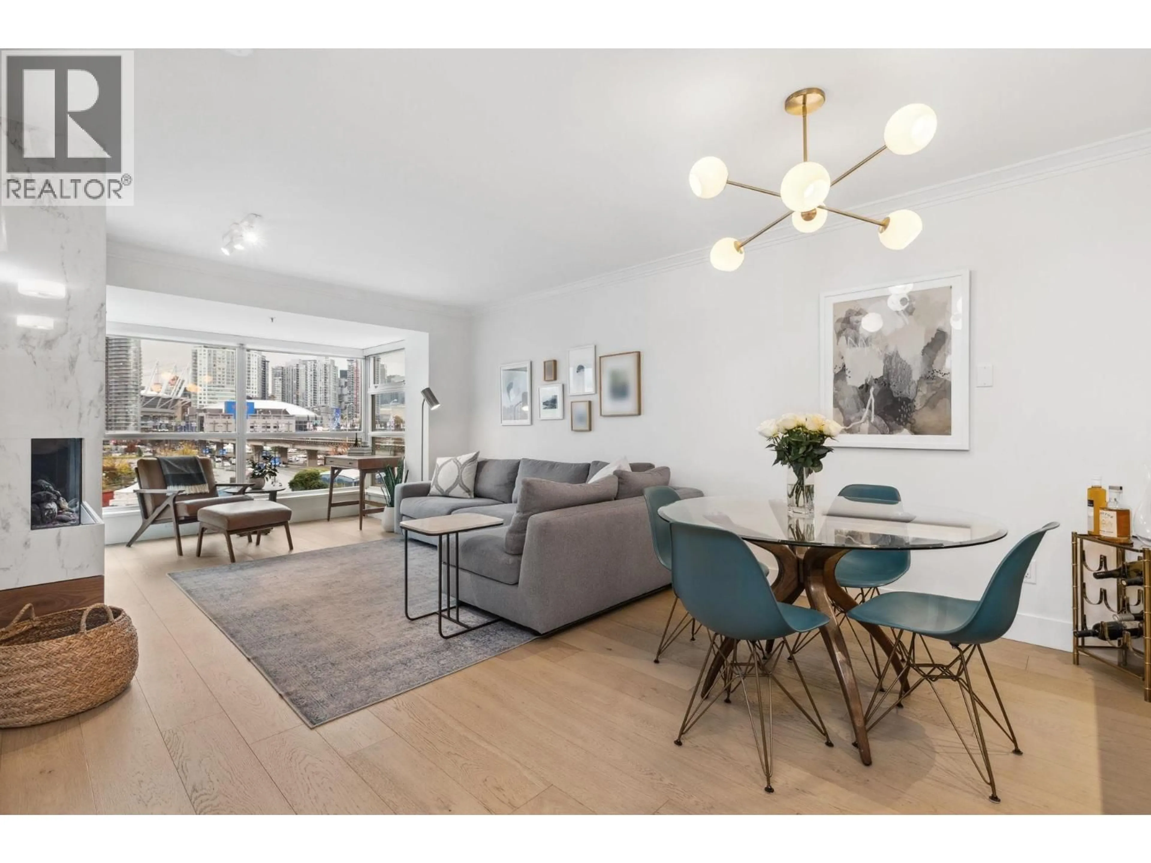 Living room with furniture, wood/laminate floor for 507 - 125 MILROSS AVENUE, Vancouver British Columbia V6A0A1