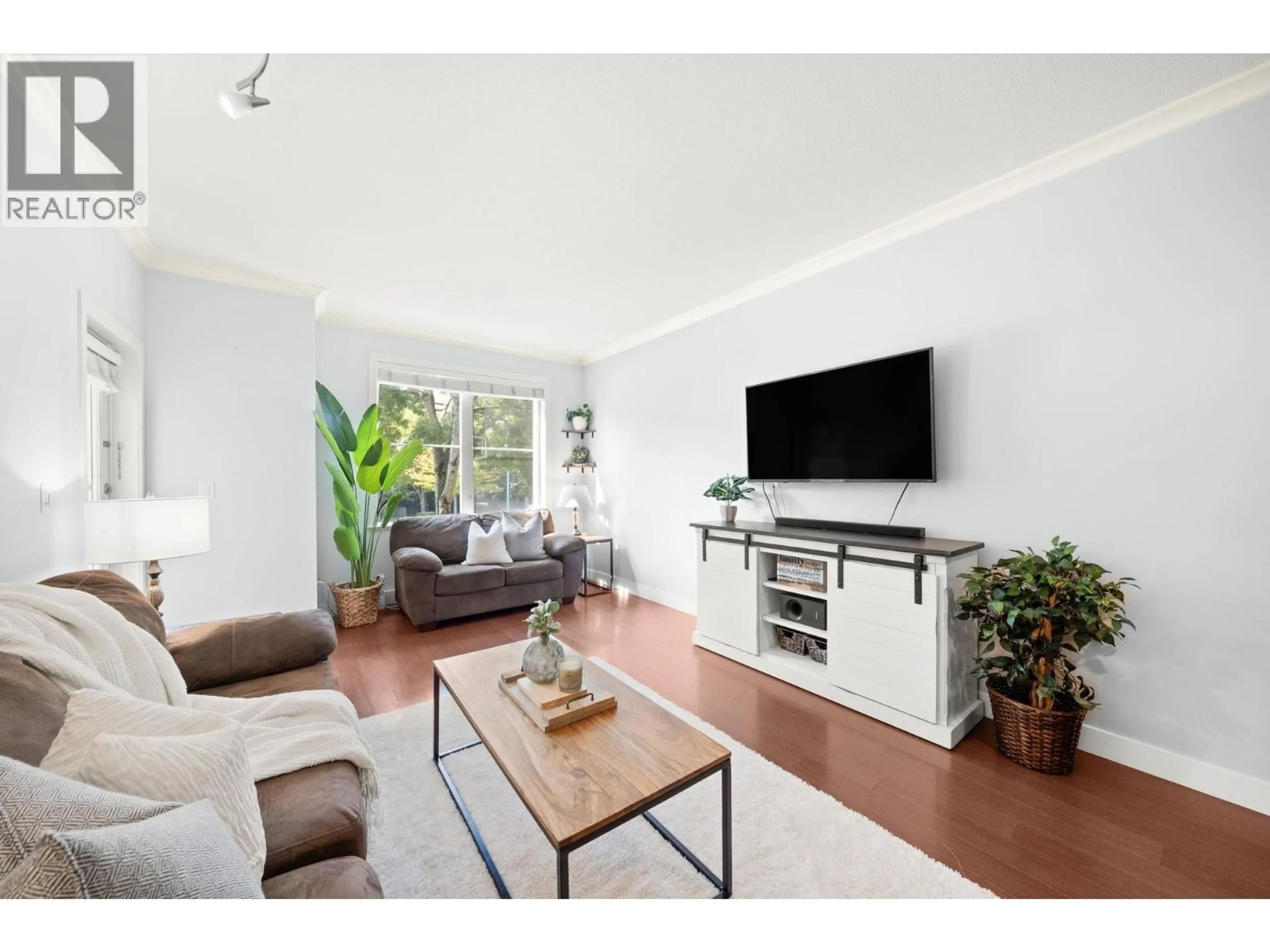 Living room with furniture, wood/laminate floor for 206 - 1375 VIEW CRESCENT, Delta British Columbia V4L0A3