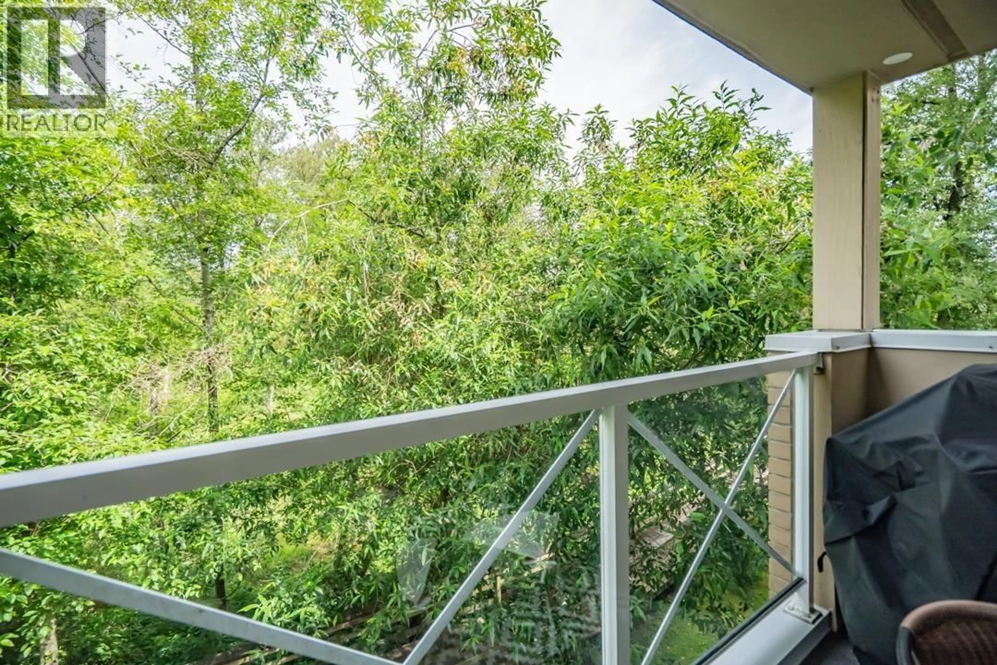 Balcony in the apartment, forest/trees view for 308 - 2551 PARKVIEW LANE, Port Coquitlam British Columbia V3C6J8