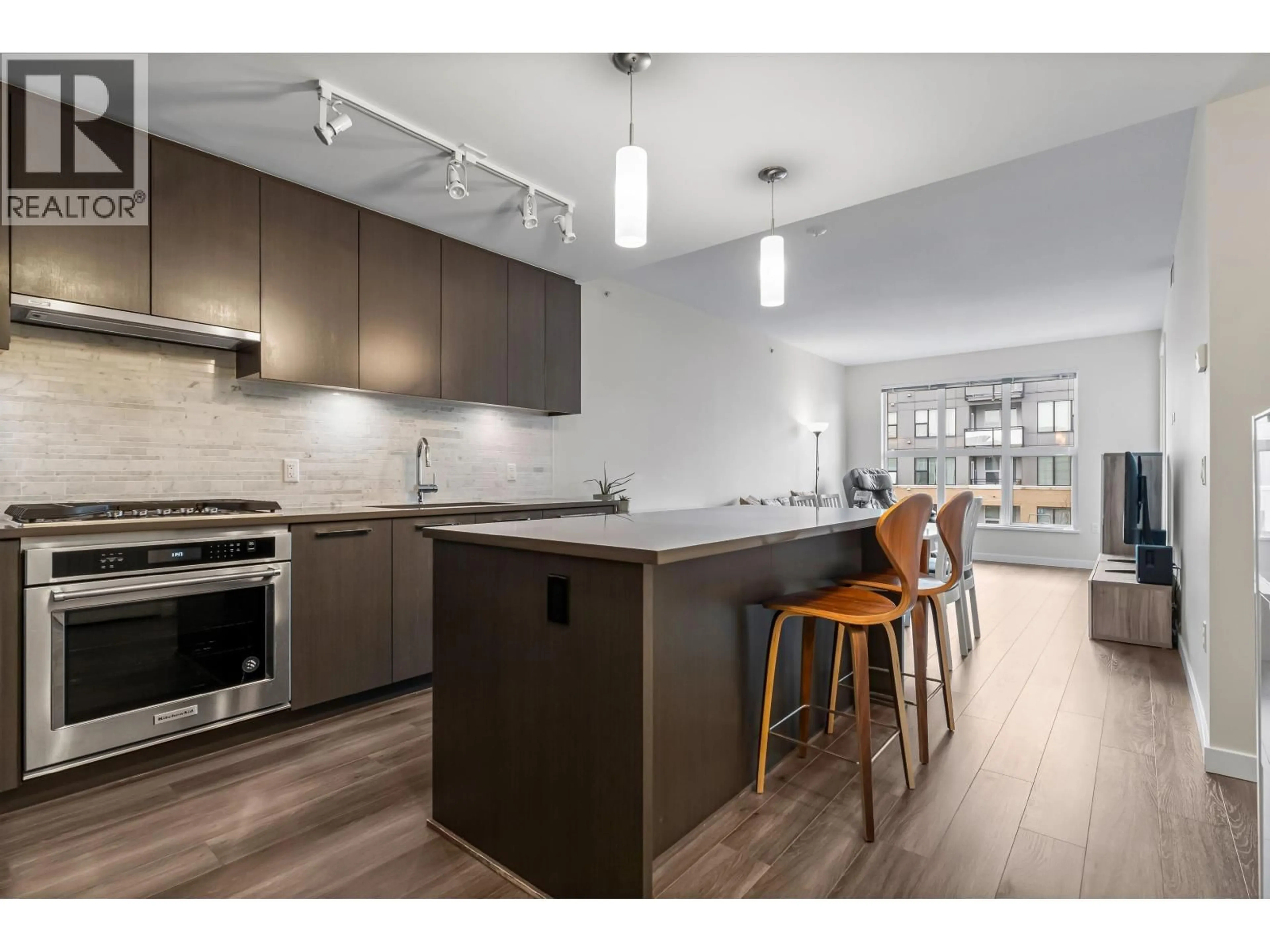 Open concept kitchen, wood/laminate floor for 408 - 9551 ALEXANDRA ROAD, Richmond British Columbia V6X0S6