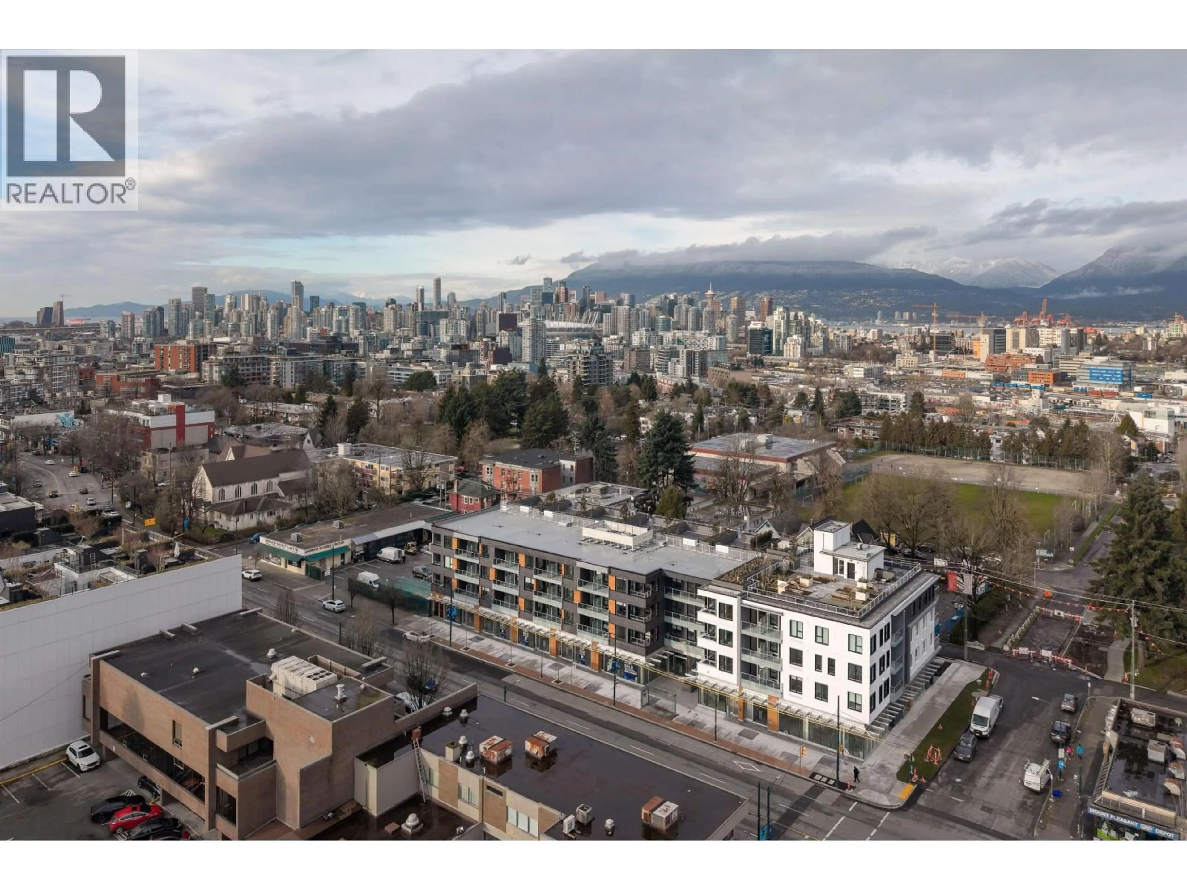 A pic from outside/outdoor area/front of a property/back of a property/a pic from drone, mountain view for 406 - 2471 SAINT GEORGE STREET, Vancouver British Columbia V5T0L9