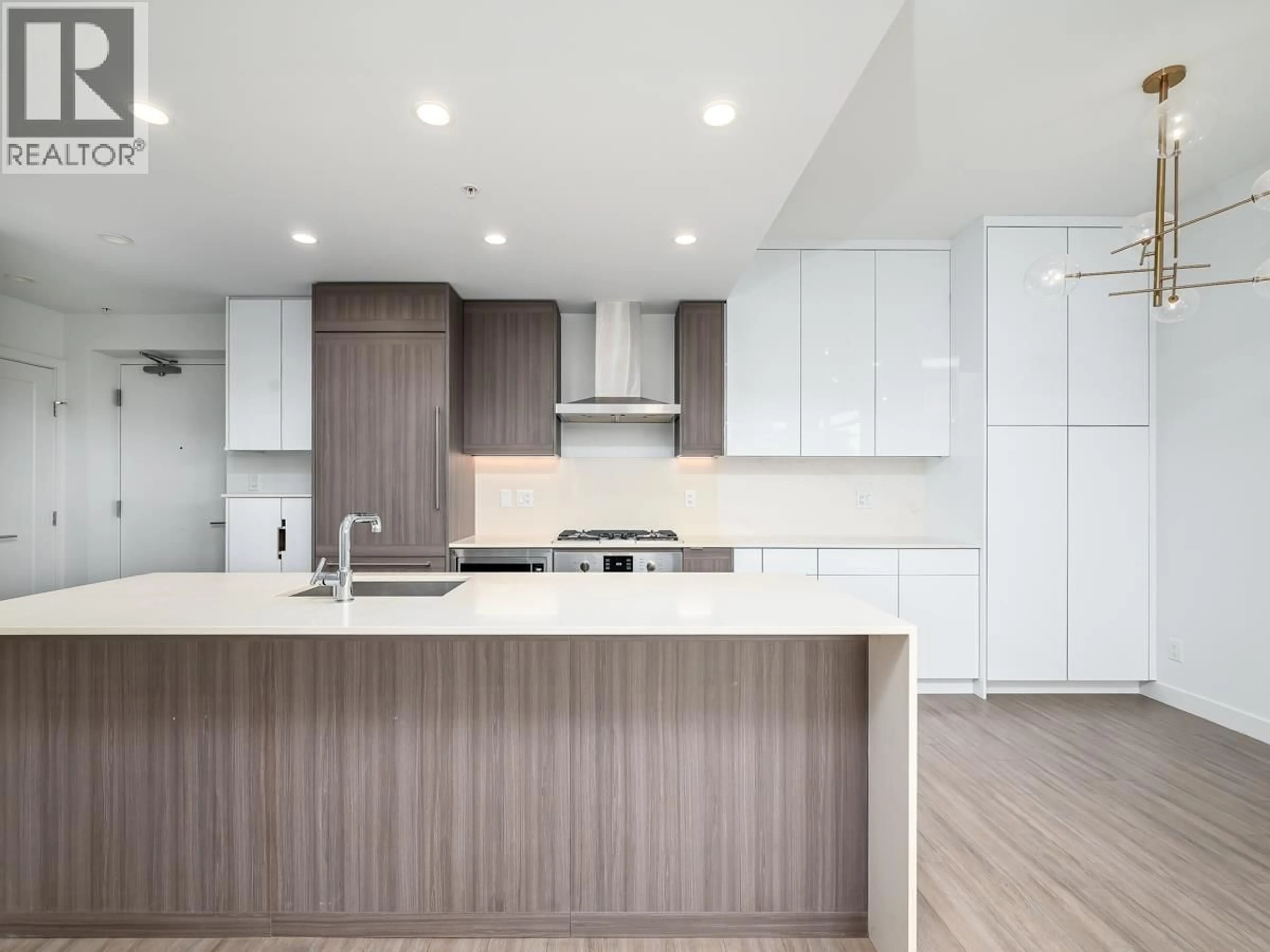 Open concept kitchen, wood/laminate floor for 301 - 2351 BETA AVENUE, Burnaby British Columbia V5C0M2