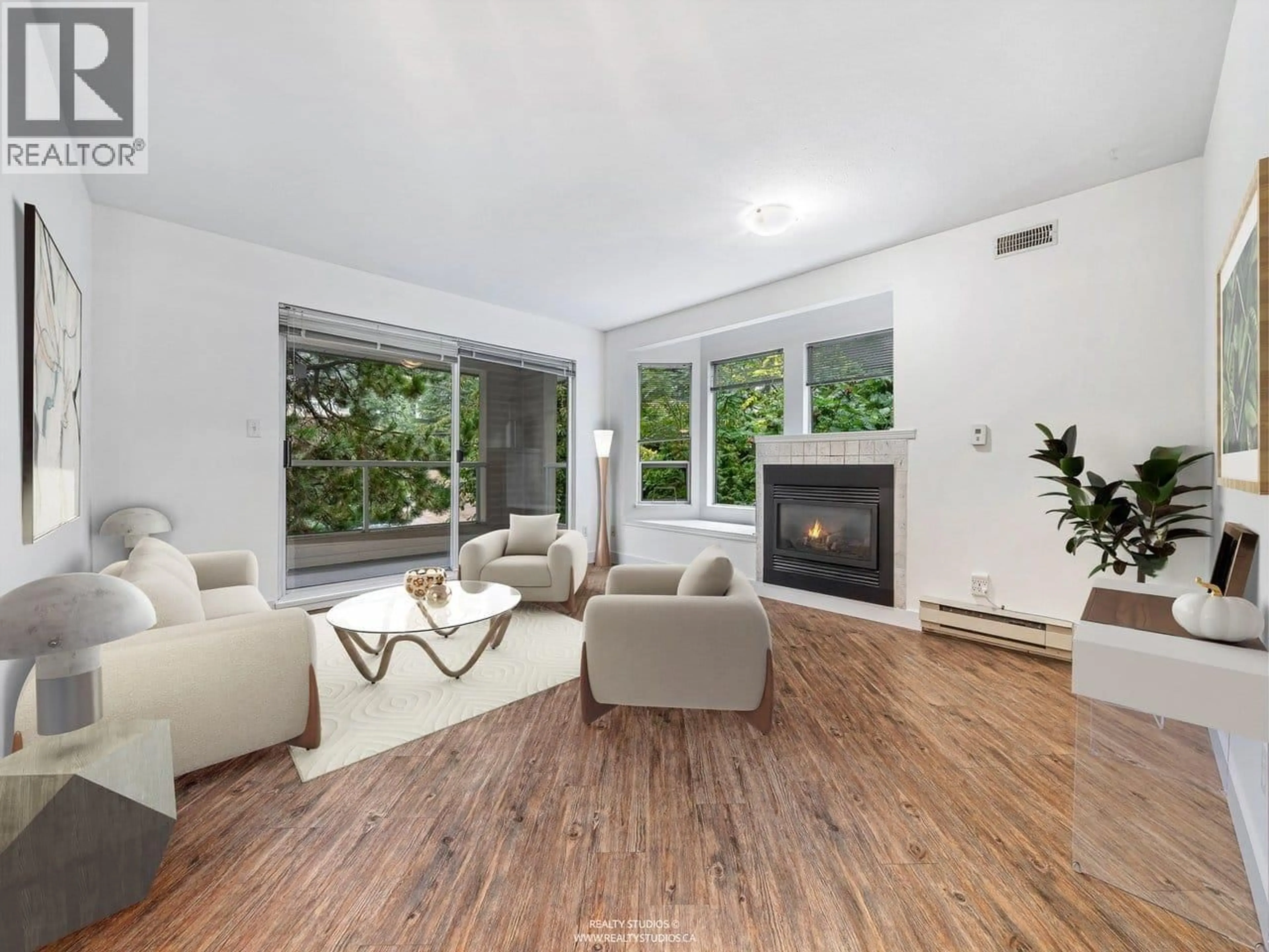 Living room with furniture, wood/laminate floor for 303 - 123 6TH STREET, North Vancouver British Columbia V7L1N9