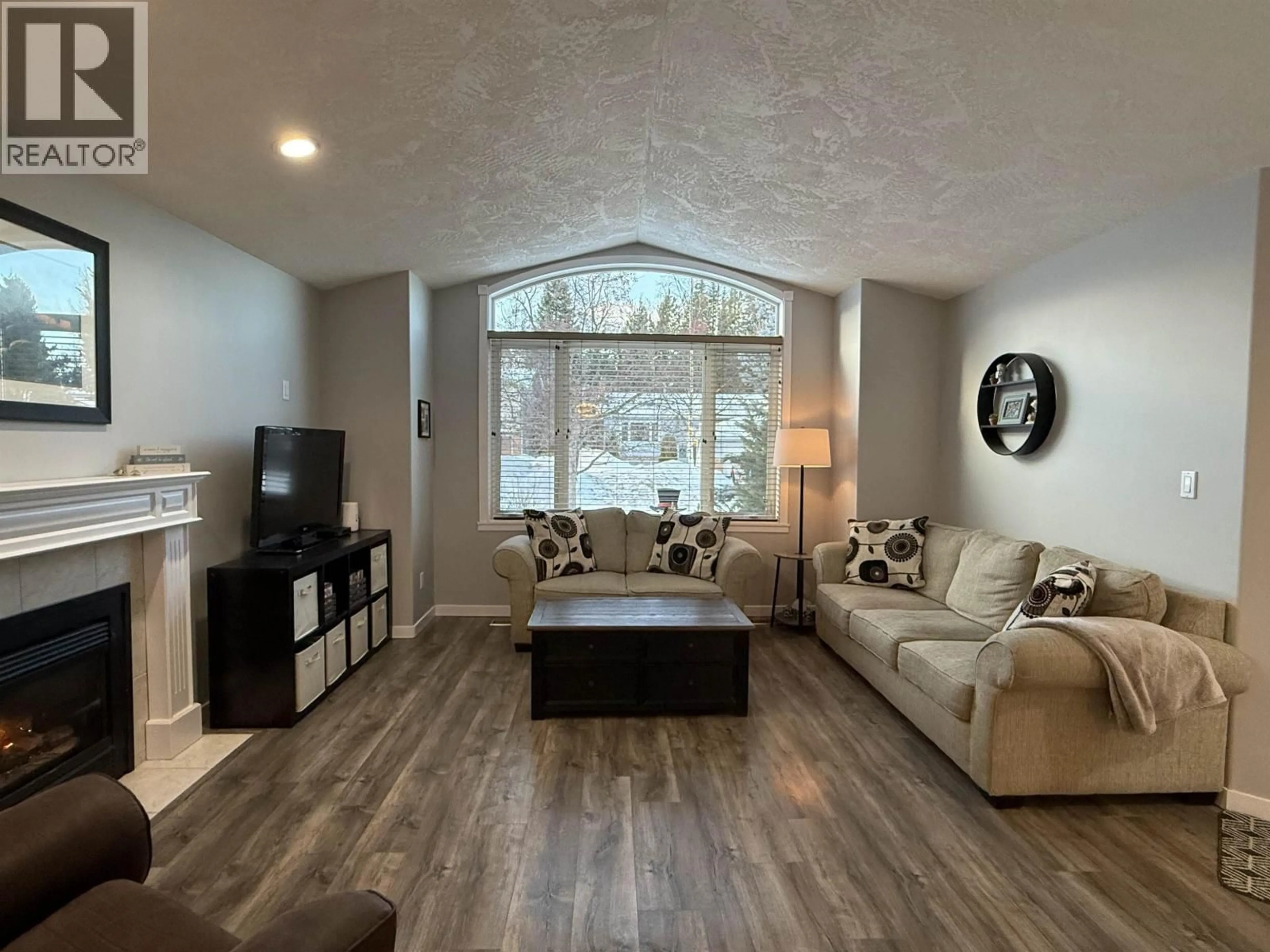 Living room with furniture, wood/laminate floor for 6230 BERGER CRESCENT, Prince George British Columbia V2K4S9