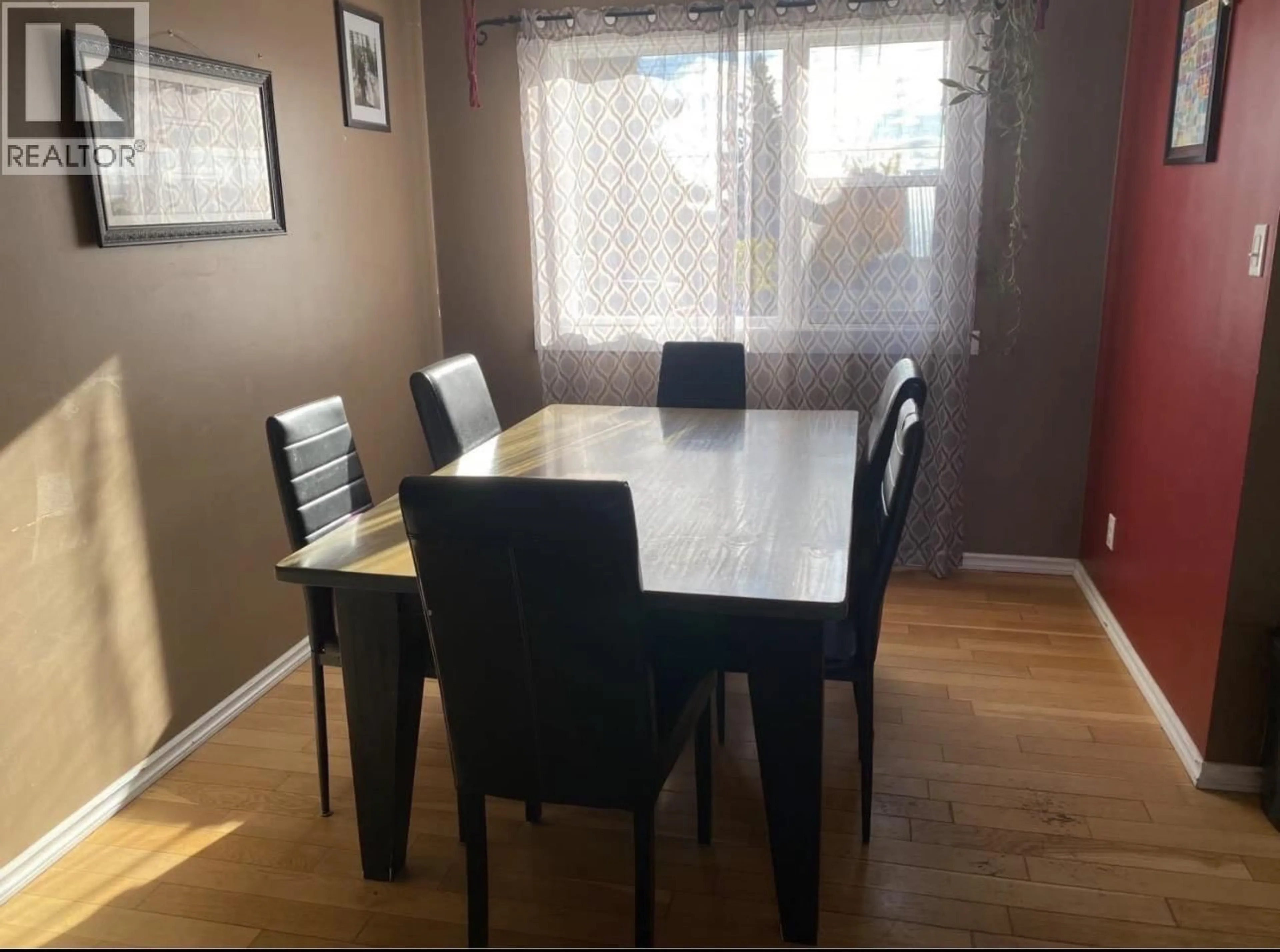 Dining room, wood/laminate floor for 10615 105 AVENUE, Fort St. John British Columbia V1J2M9