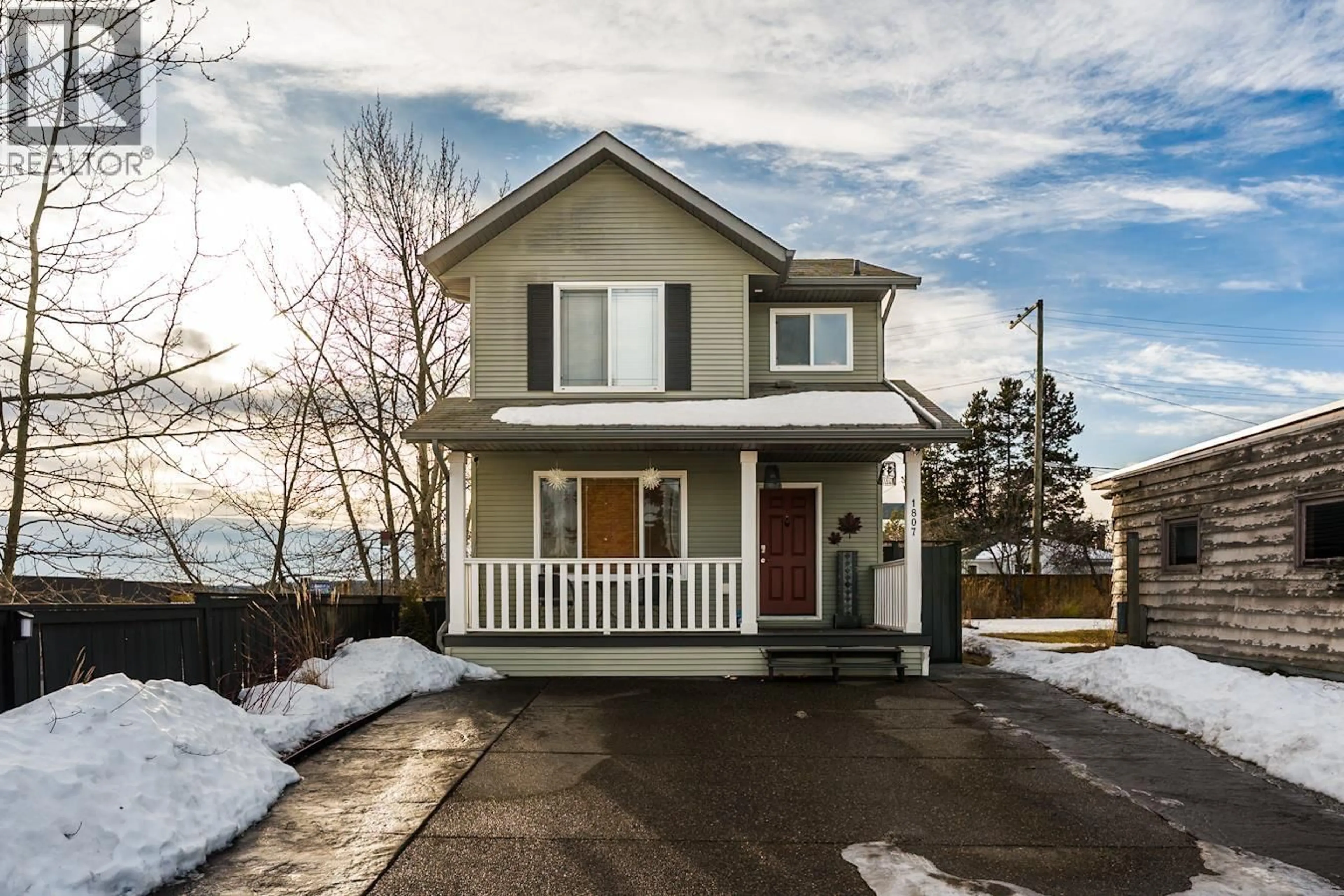 Home with vinyl exterior material, street for 1807 12TH AVENUE, Prince George British Columbia V2M1P8