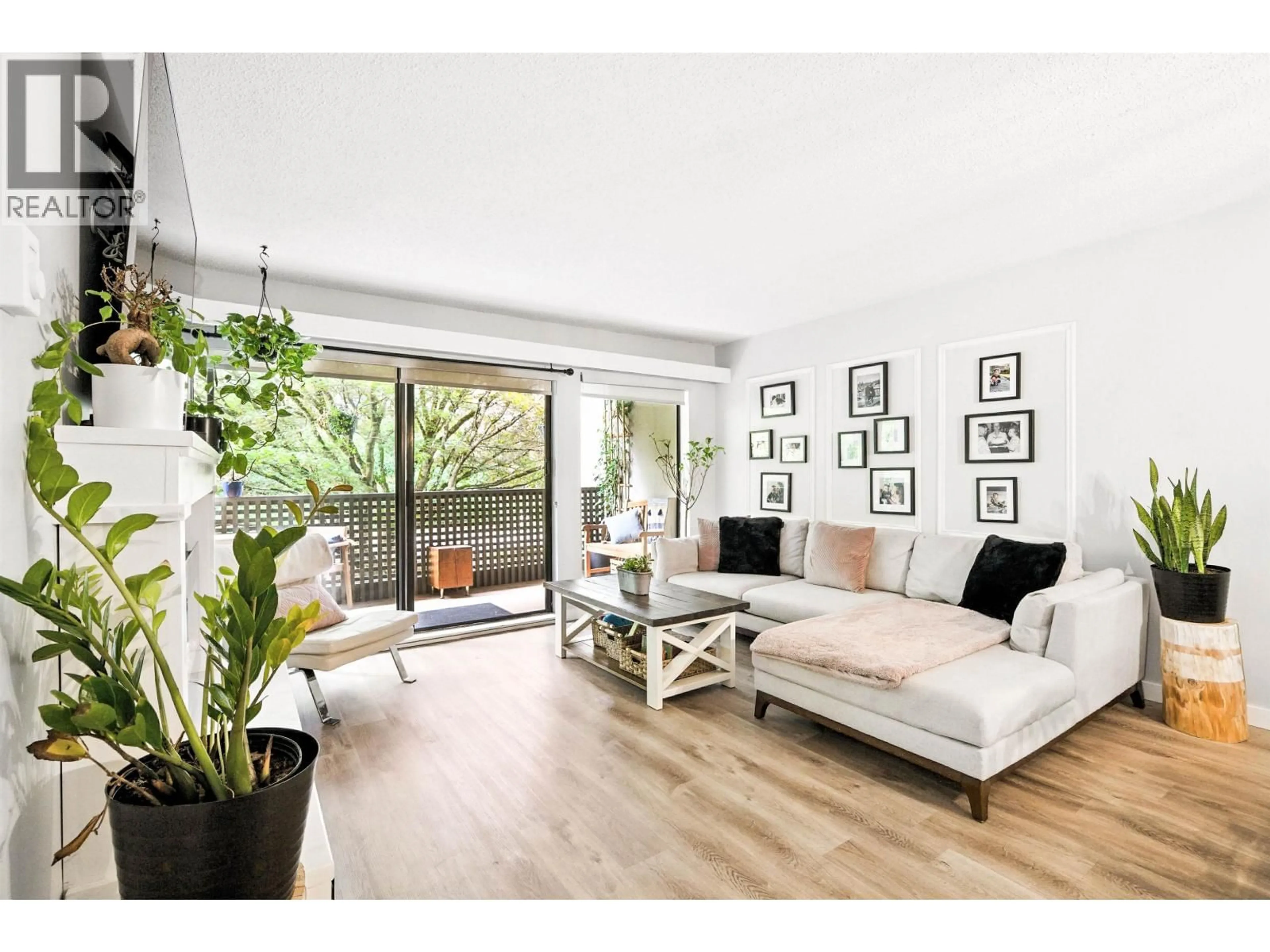 Living room with furniture, wood/laminate floor for 212 - 1955 WOODWAY PLACE, Burnaby British Columbia V5B4S5