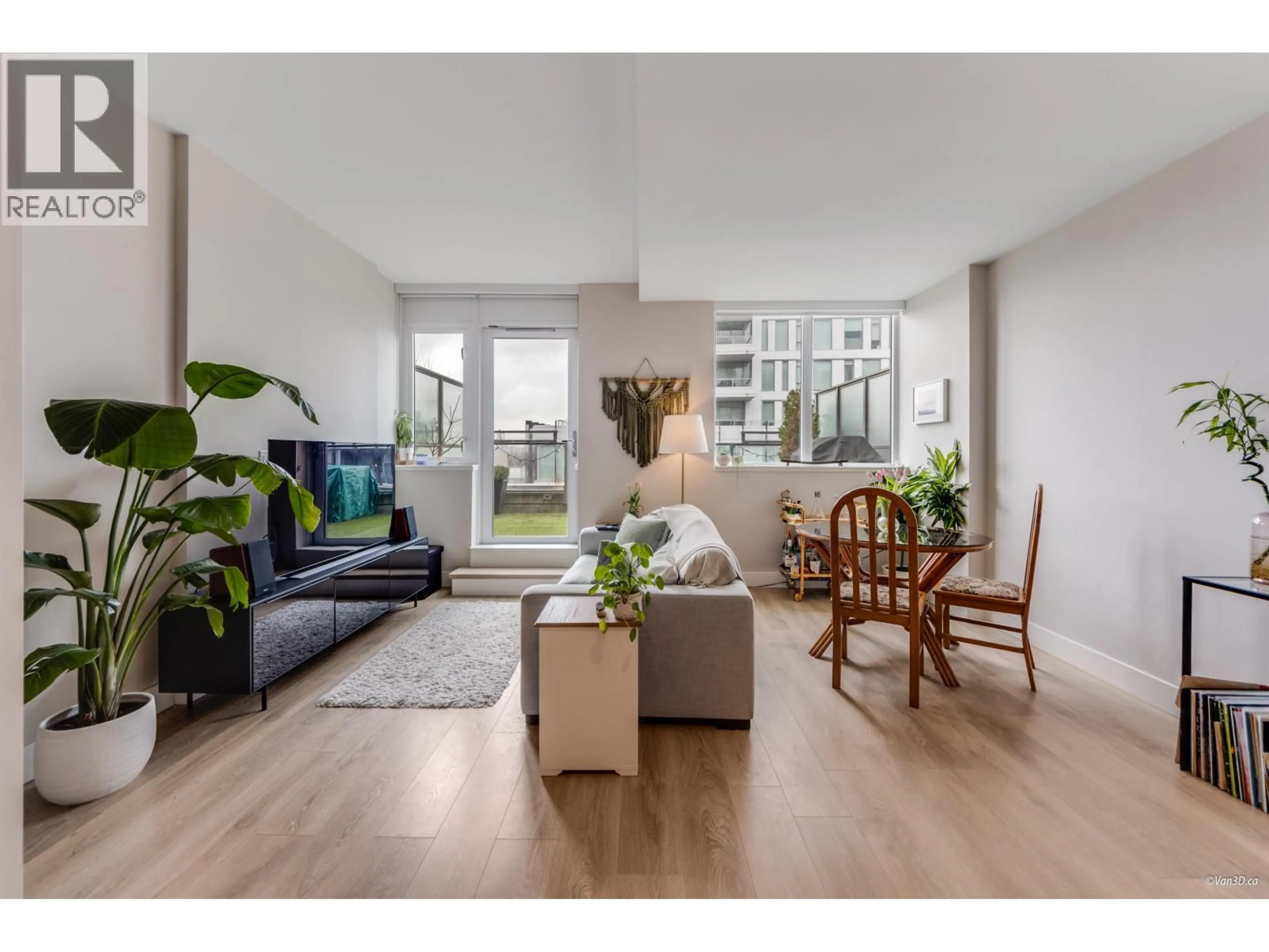 Living room with furniture, wood/laminate floor for 505 - 3451 SAWMILL CRESCENT, Vancouver British Columbia V5S0H3