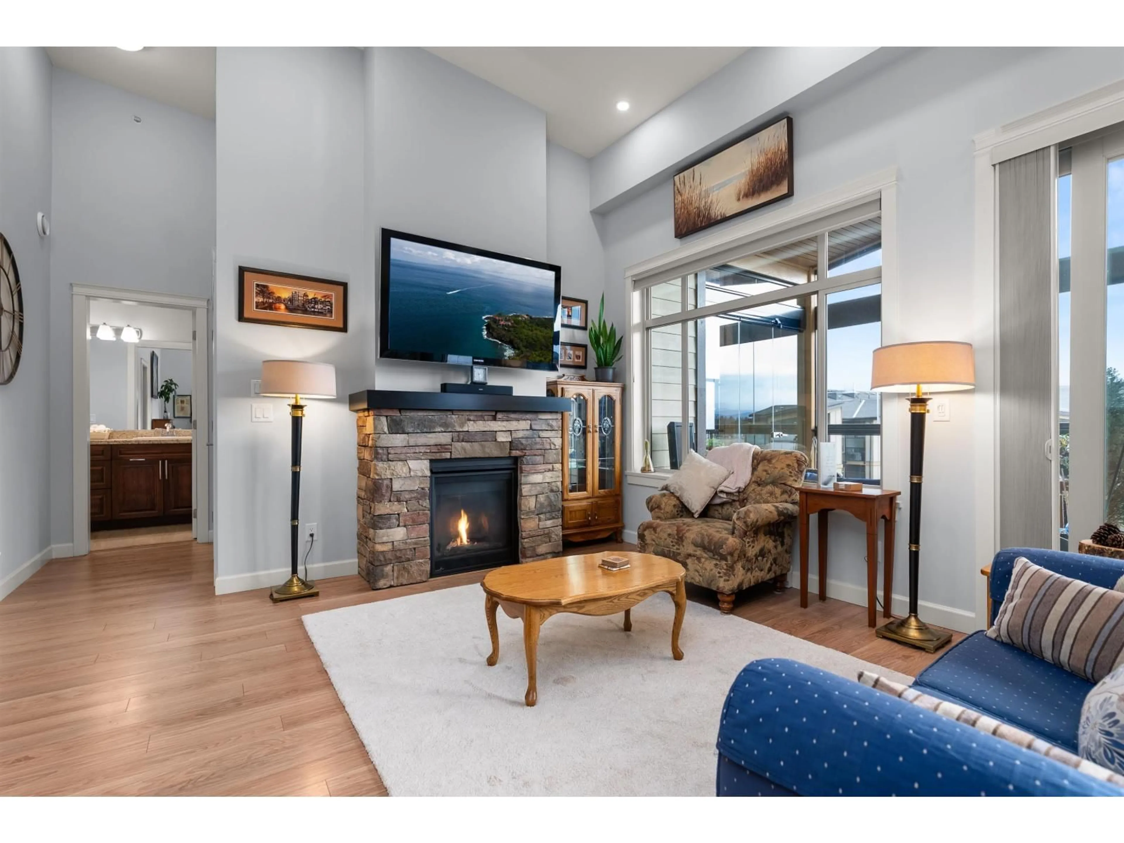 Living room with furniture, wood/laminate floor for 609 - 2860 TRETHEWEY STREET, Abbotsford British Columbia V2T0G5