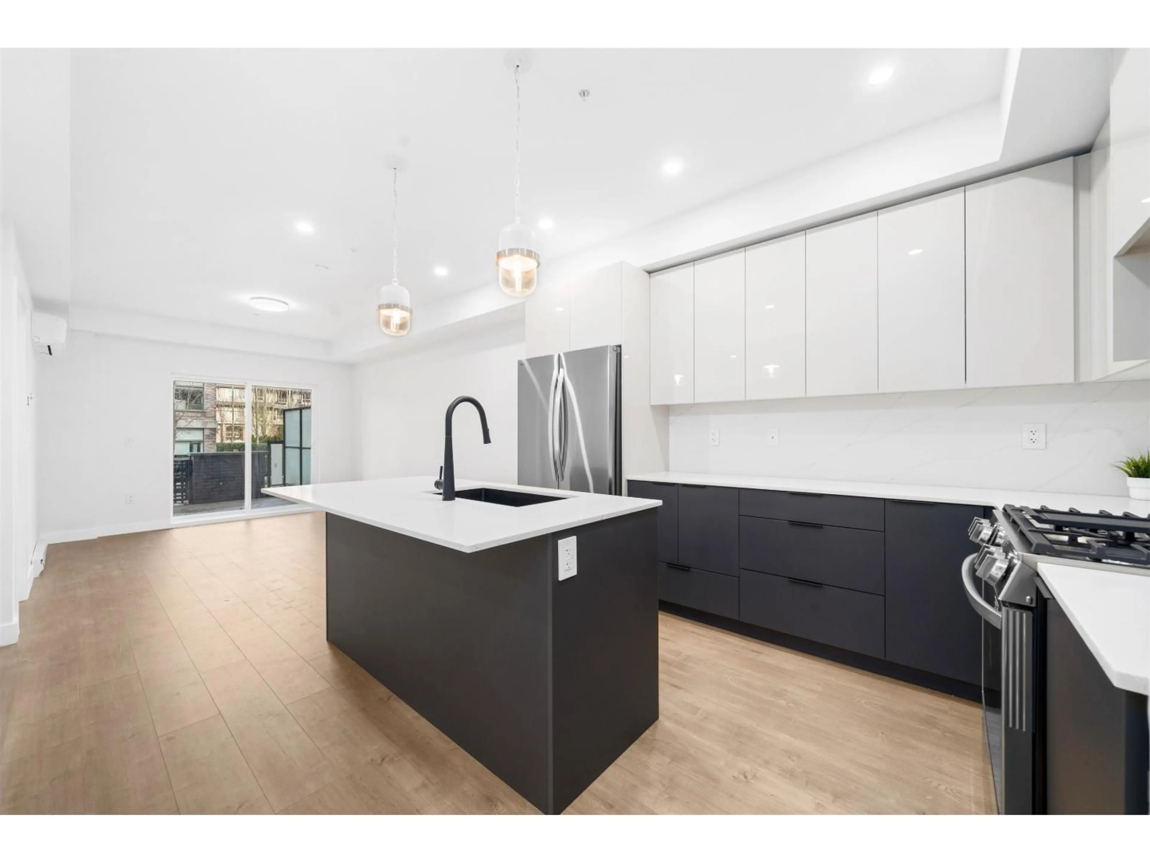 Open concept kitchen, unknown for 101 - 15353 17 AVENUE, Surrey British Columbia V4A0E2