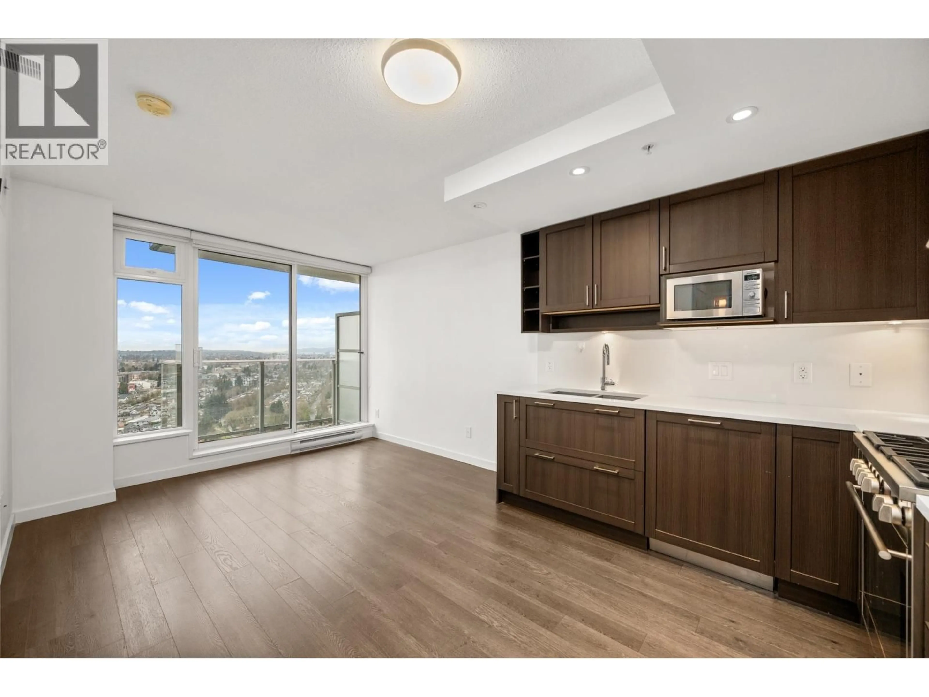 Open concept kitchen, wood/laminate floor for 2810 - 5665 BOUNDARY ROAD, Vancouver British Columbia V5R0E4