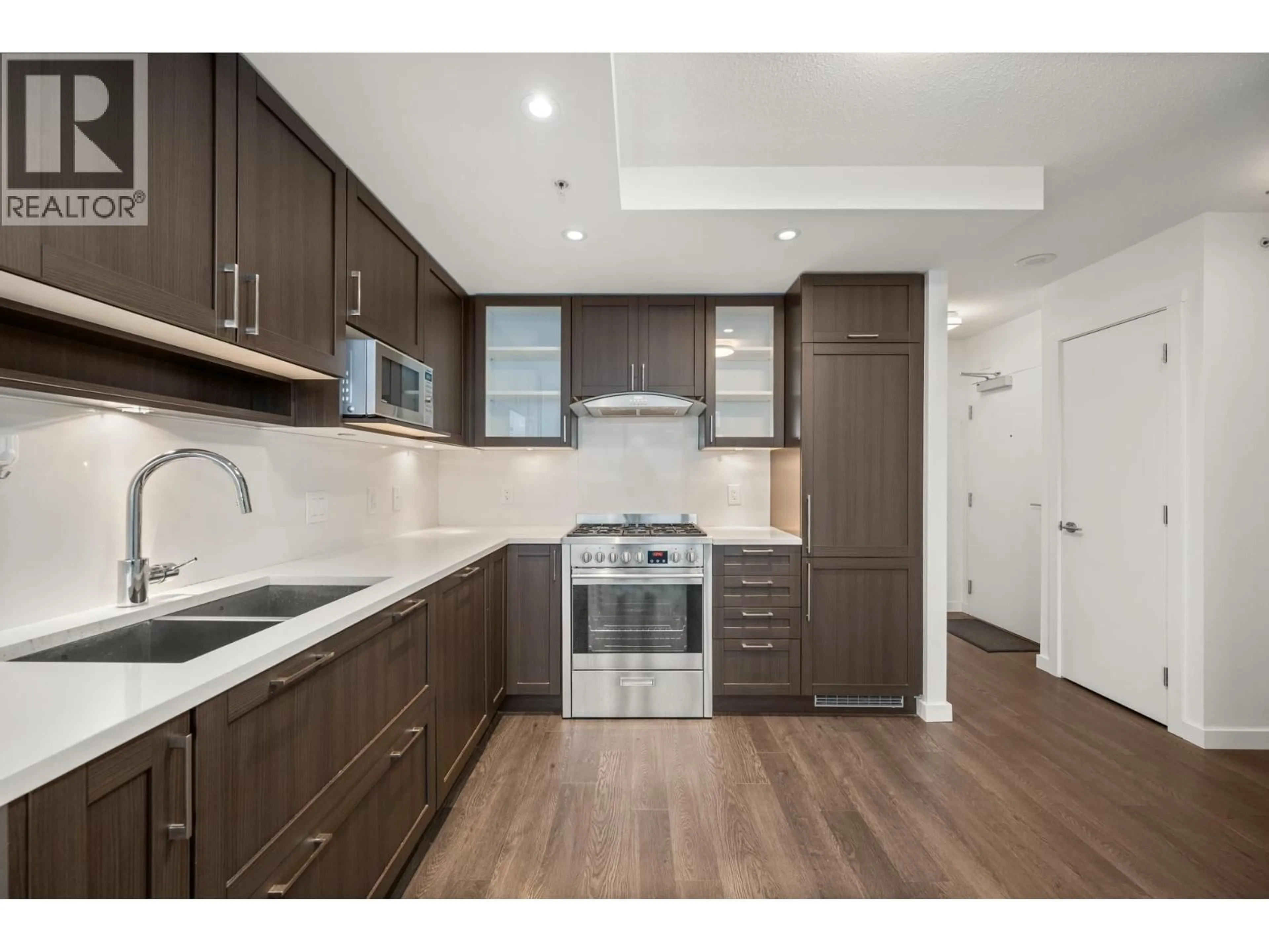 Open concept kitchen, wood/laminate floor for 2810 - 5665 BOUNDARY ROAD, Vancouver British Columbia V5R0E4
