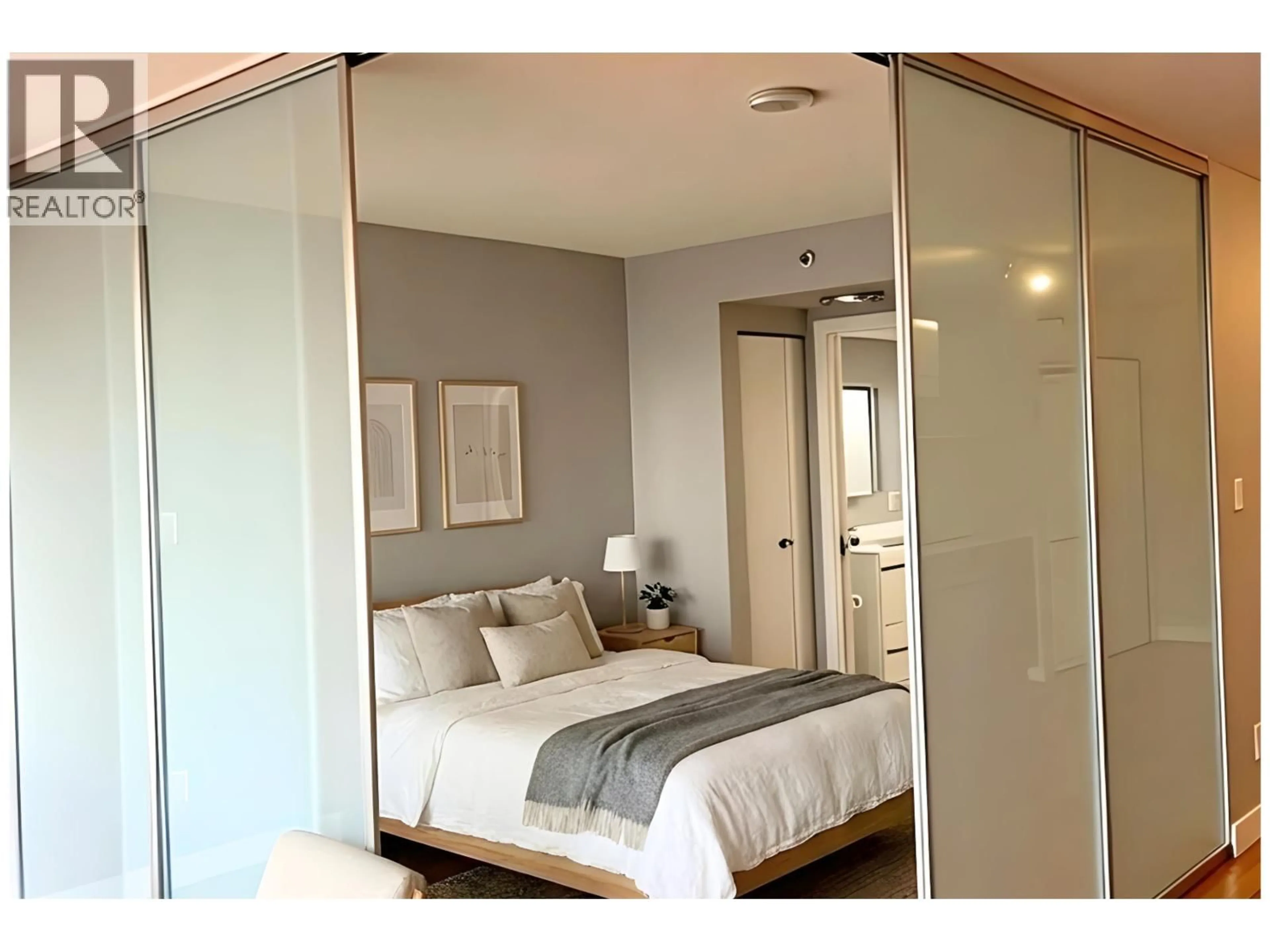 Bedroom with bed, wood/laminate floor for 503 - 718 MAIN STREET, Vancouver British Columbia V6A0B1