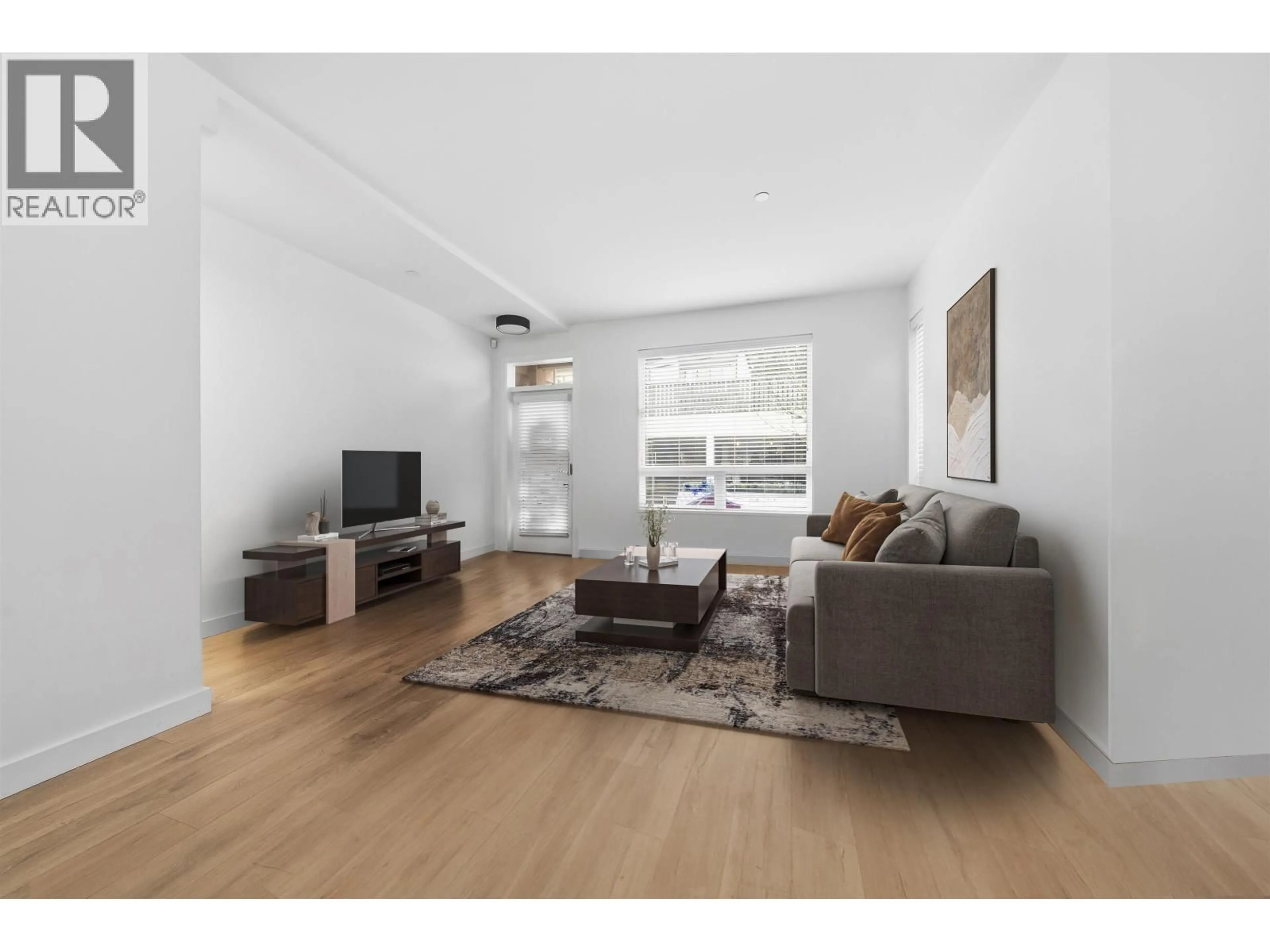 Living room with furniture, wood/laminate floor for 601 - 3021 ST GEORGE STREET, Port Moody British Columbia V3H0K3