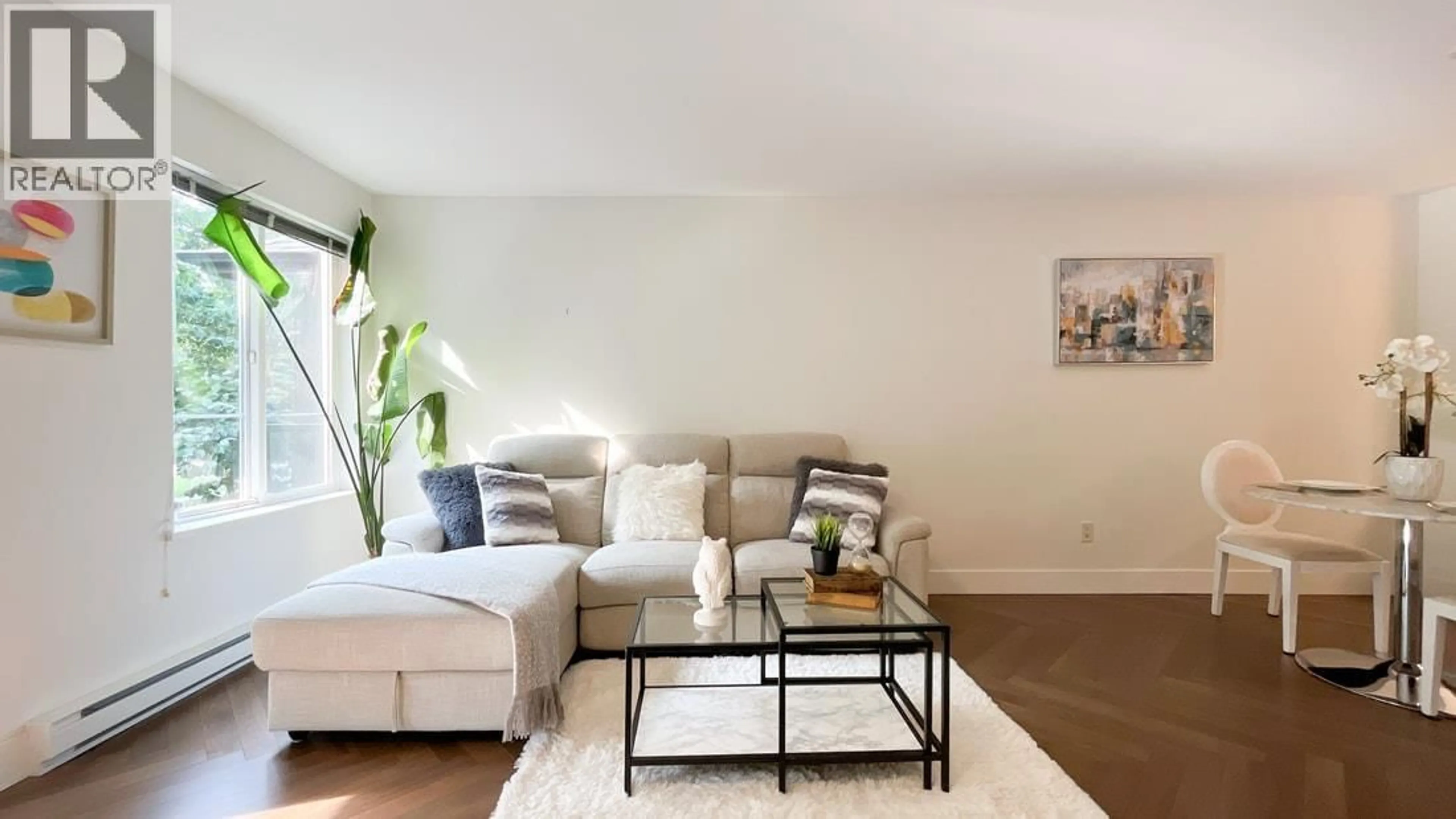 Living room with furniture, wood/laminate floor for 312 - 7000 21 AVENUE, Burnaby British Columbia V5E4P1