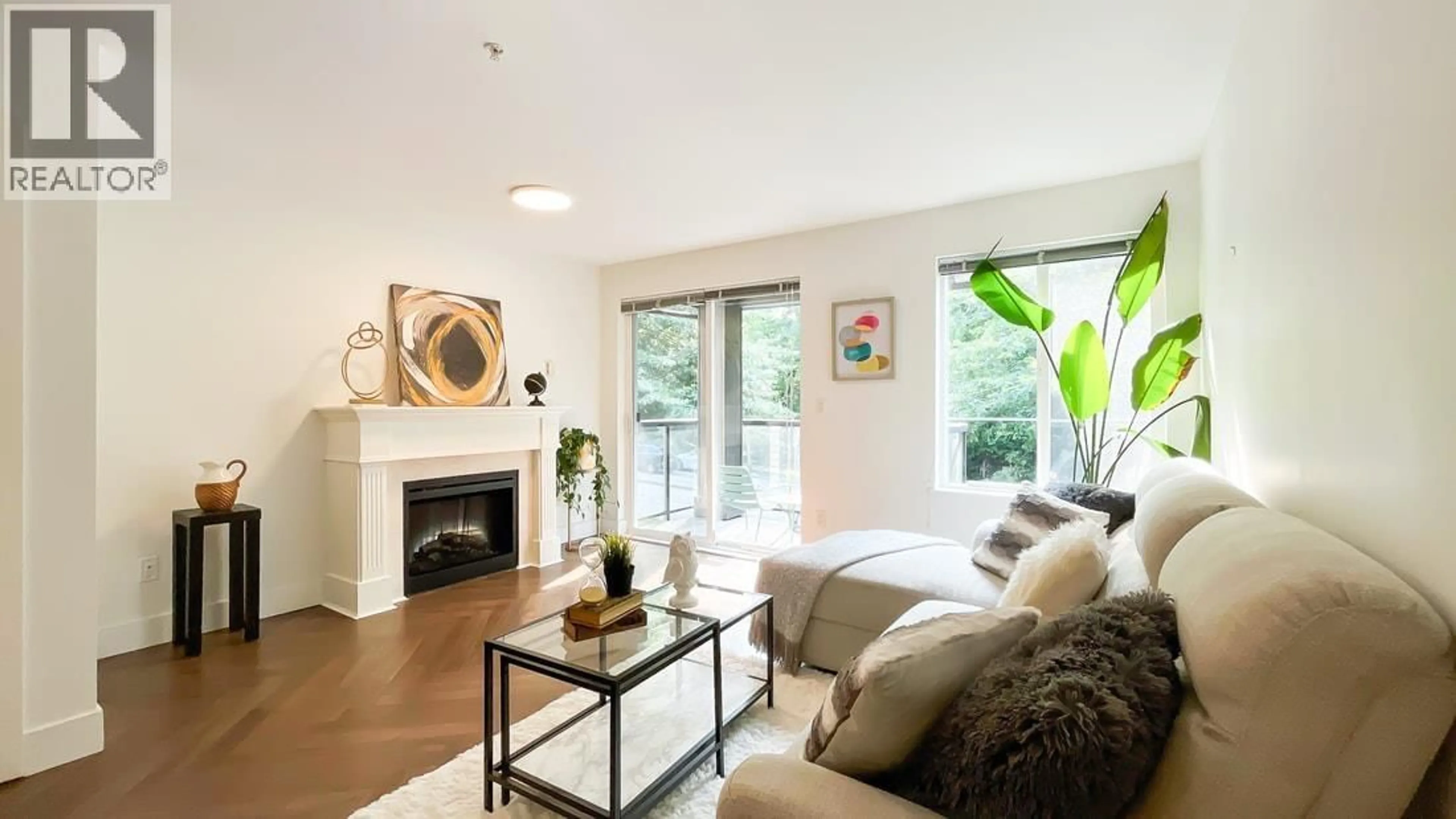 Living room with furniture, wood/laminate floor for 312 - 7000 21 AVENUE, Burnaby British Columbia V5E4P1