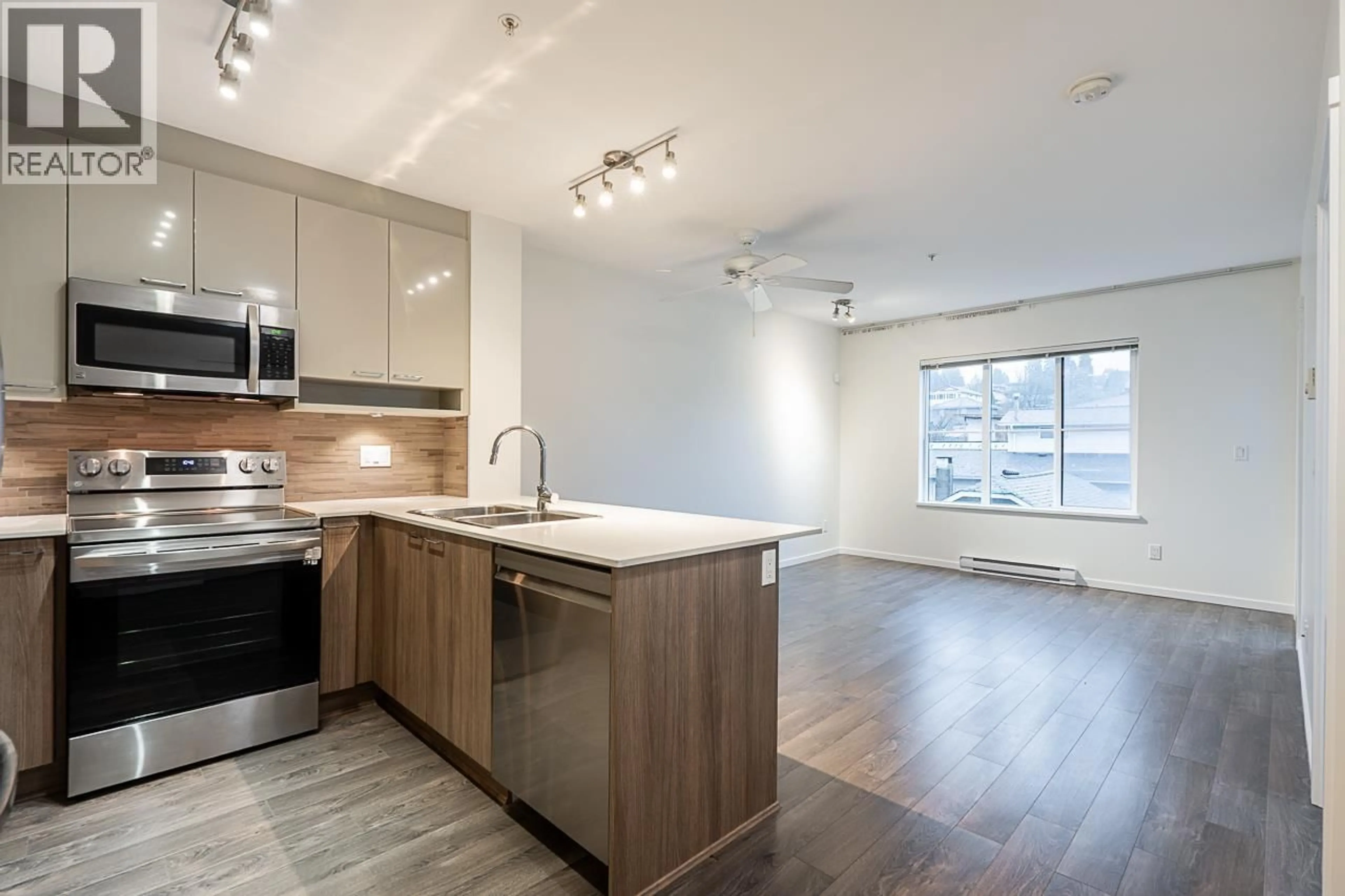 Open concept kitchen, wood/laminate floor for 309 - 210 LEBLEU STREET, Coquitlam British Columbia V3K4L6
