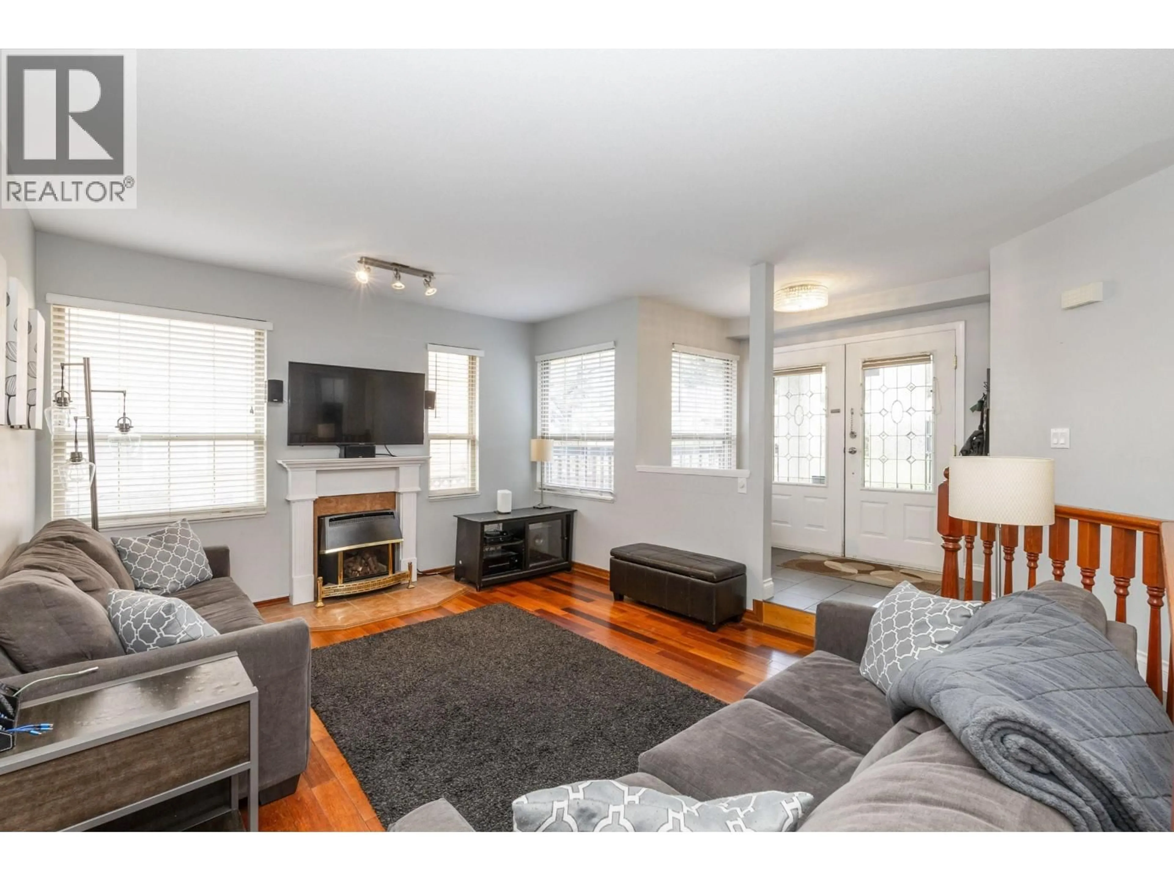 Living room with furniture, wood/laminate floor for 1020 STEWART AVENUE, Coquitlam British Columbia V3K2N6