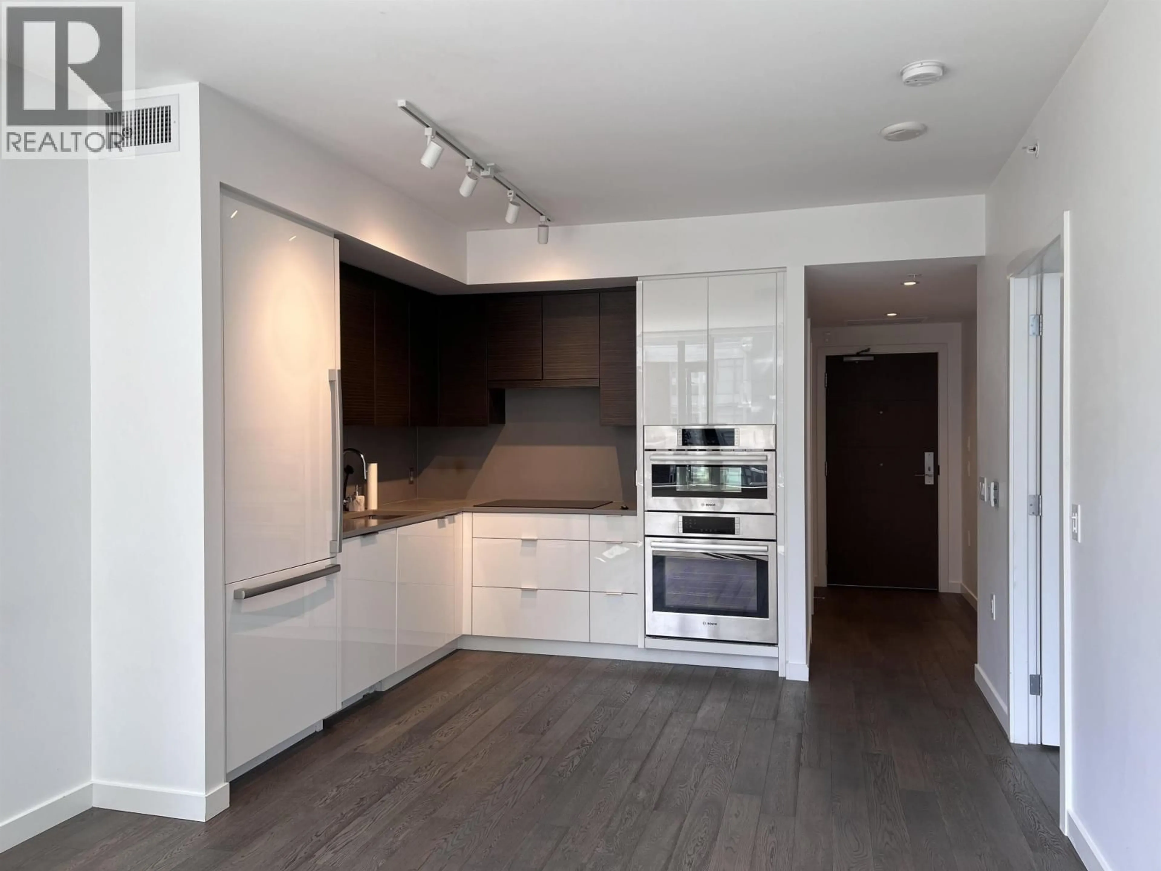 Open concept kitchen, wood/laminate floor for 407 - 1678 PULLMAN PORTER STREET, Vancouver British Columbia V6A0H4