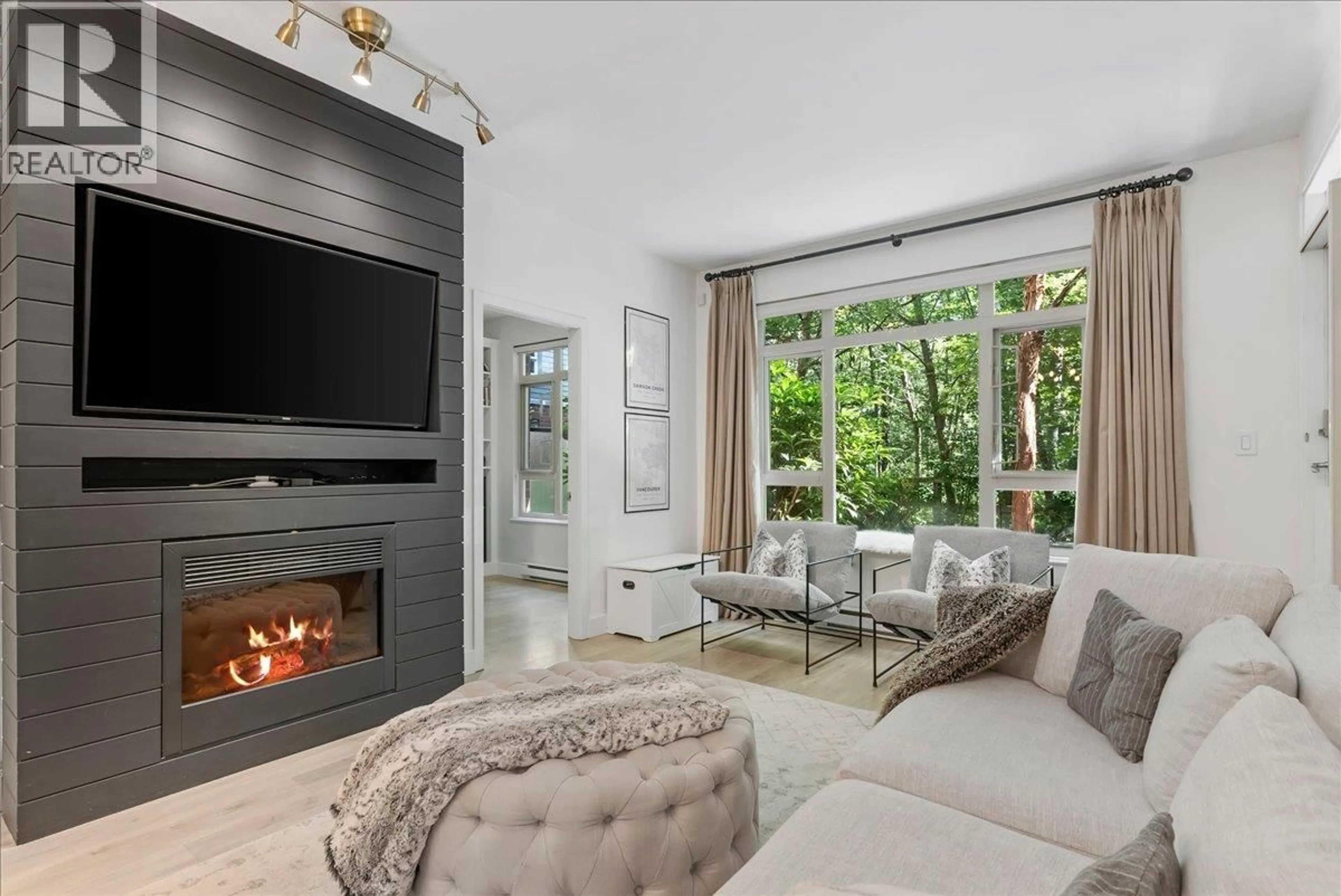 Living room with furniture, unknown for 106 - 200 CAPILANO ROAD, Port Moody British Columbia V3H5N1