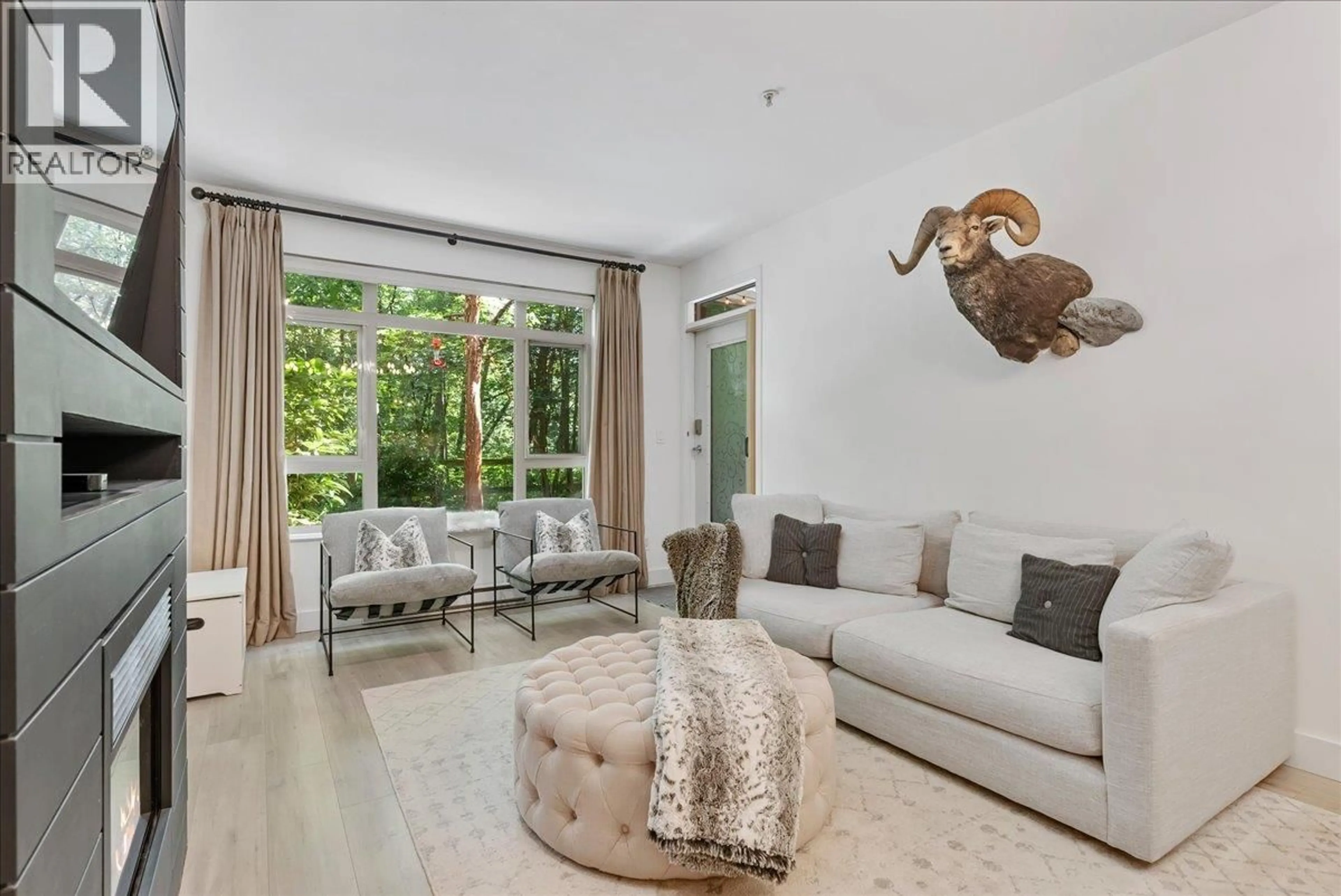 Living room with furniture, unknown for 106 - 200 CAPILANO ROAD, Port Moody British Columbia V3H5N1